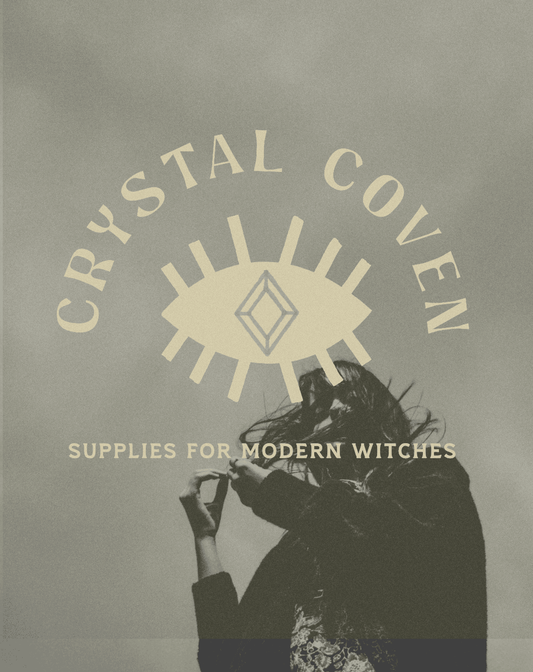 black and white image of a woman from below overlaid logo of an eye with a diamond pupil reads 'crystal coven' 'supplies for modern witches' 