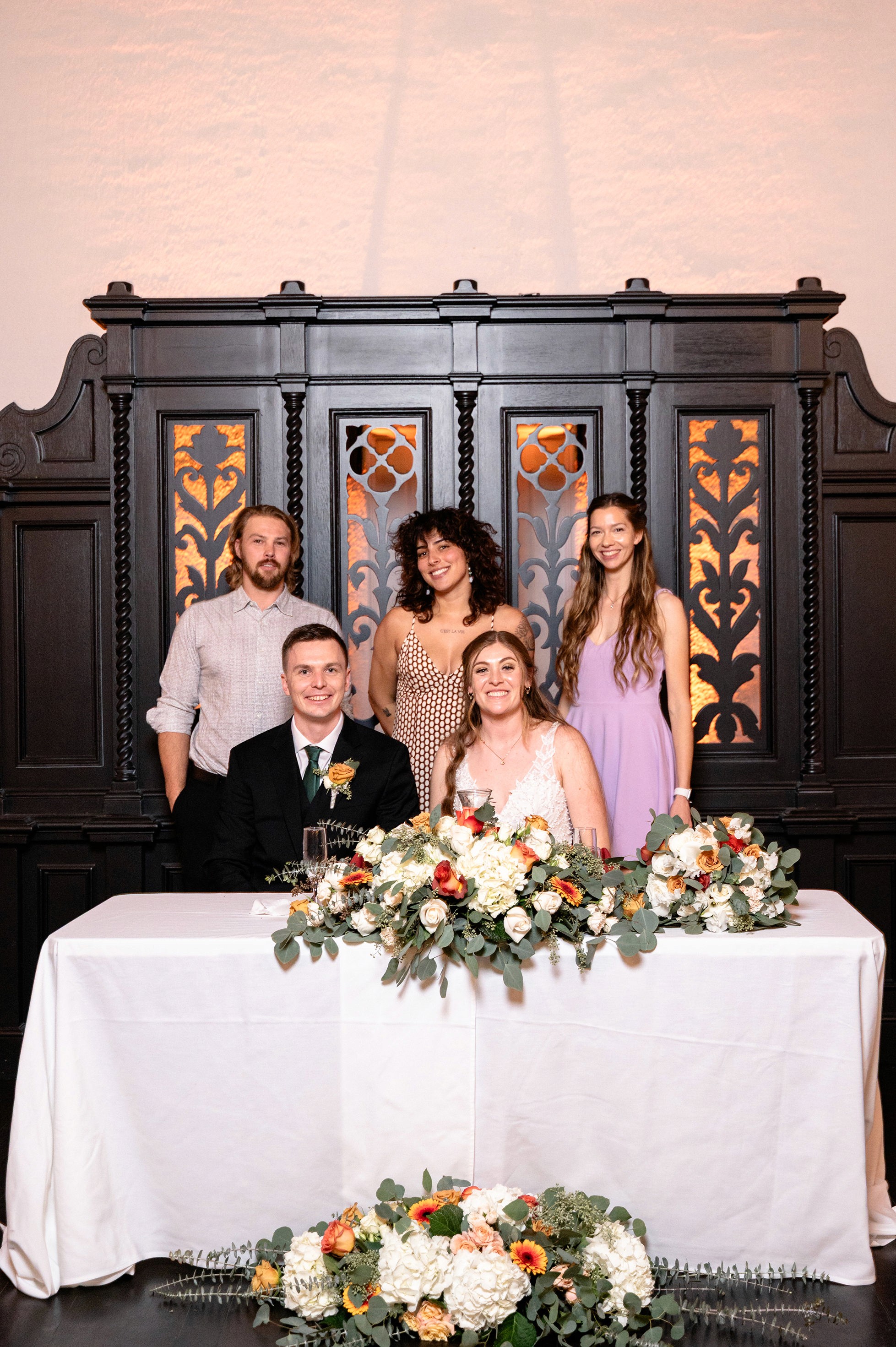 Flat lay wedding details with bouquet, rings, and sparkling bridal heels