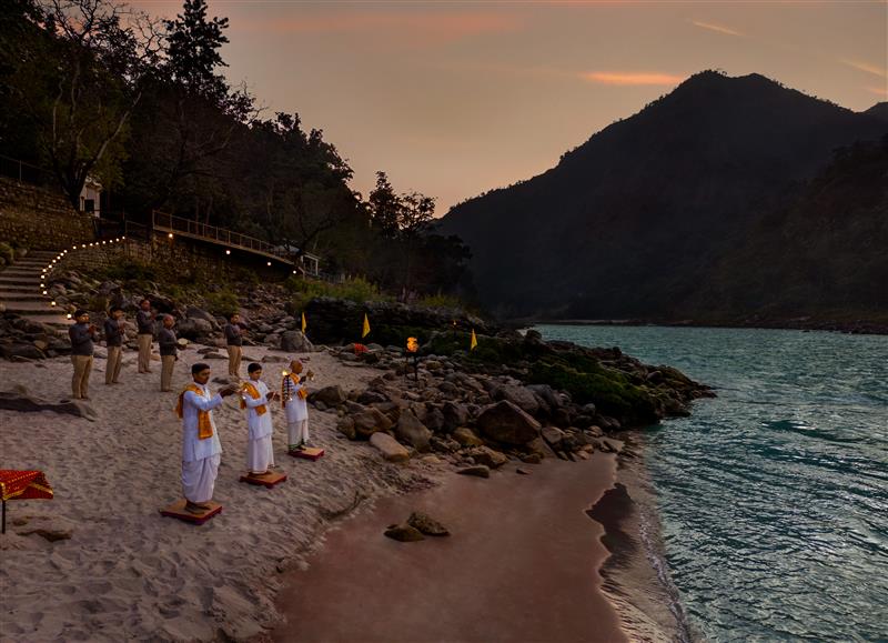 People doing aarti on river bank