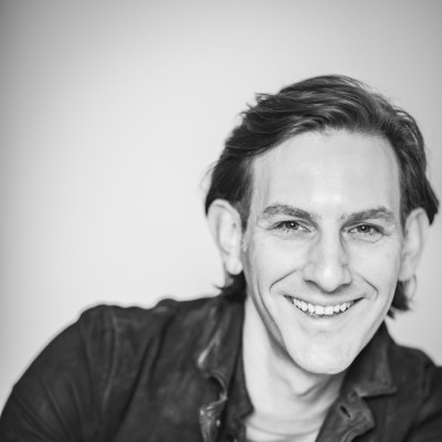 Headshot portrait of a smiling man