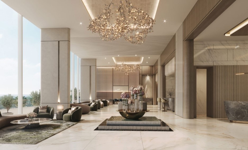 Luxurious Hilton Residences lobby and reception area featuring sparkling chandeliers, plush seating, and marble floors.