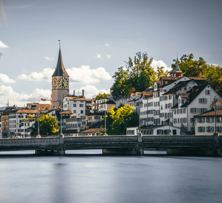 a bridge over a river with buildings on either side of it