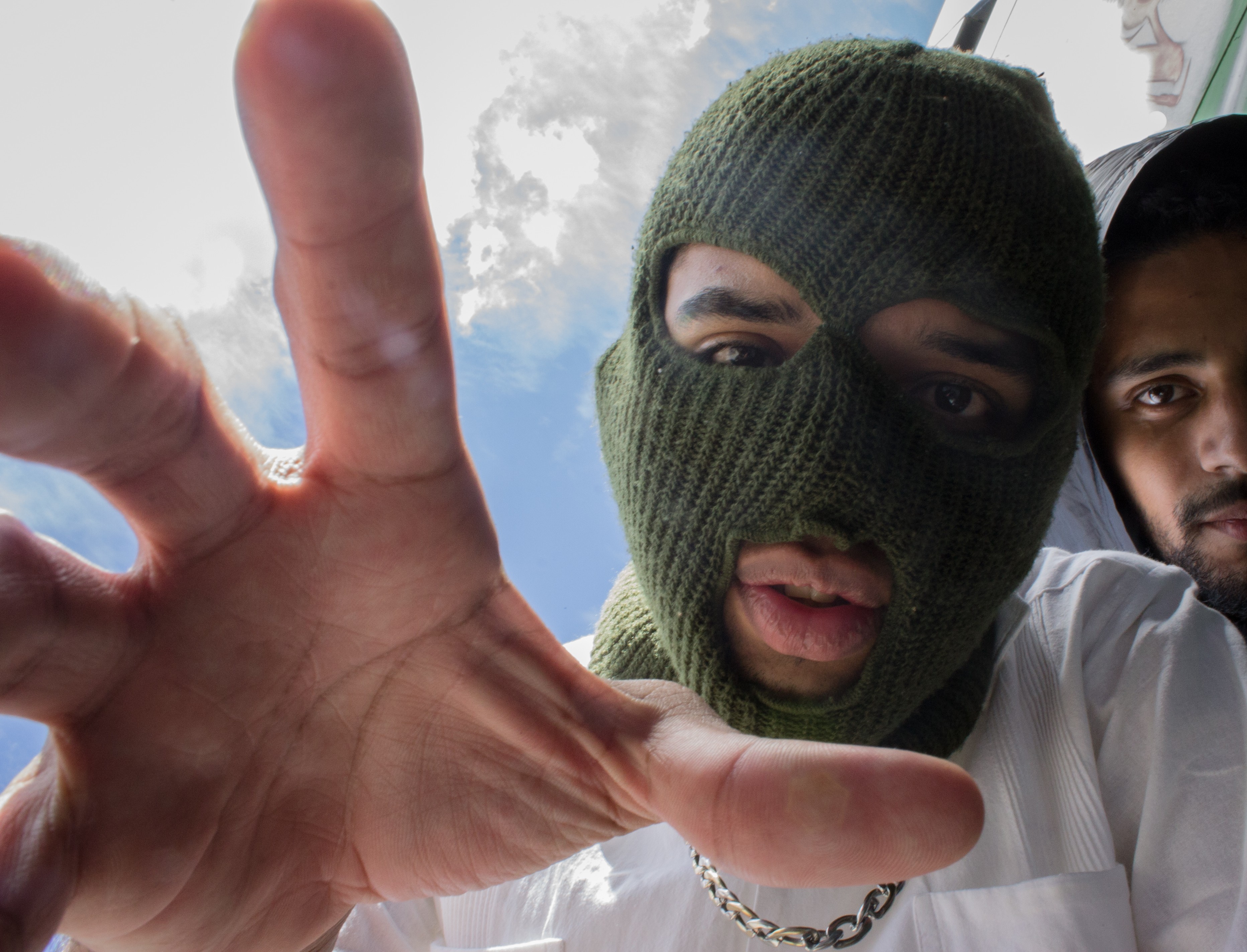 Young black woman witting at the table working on a laptop