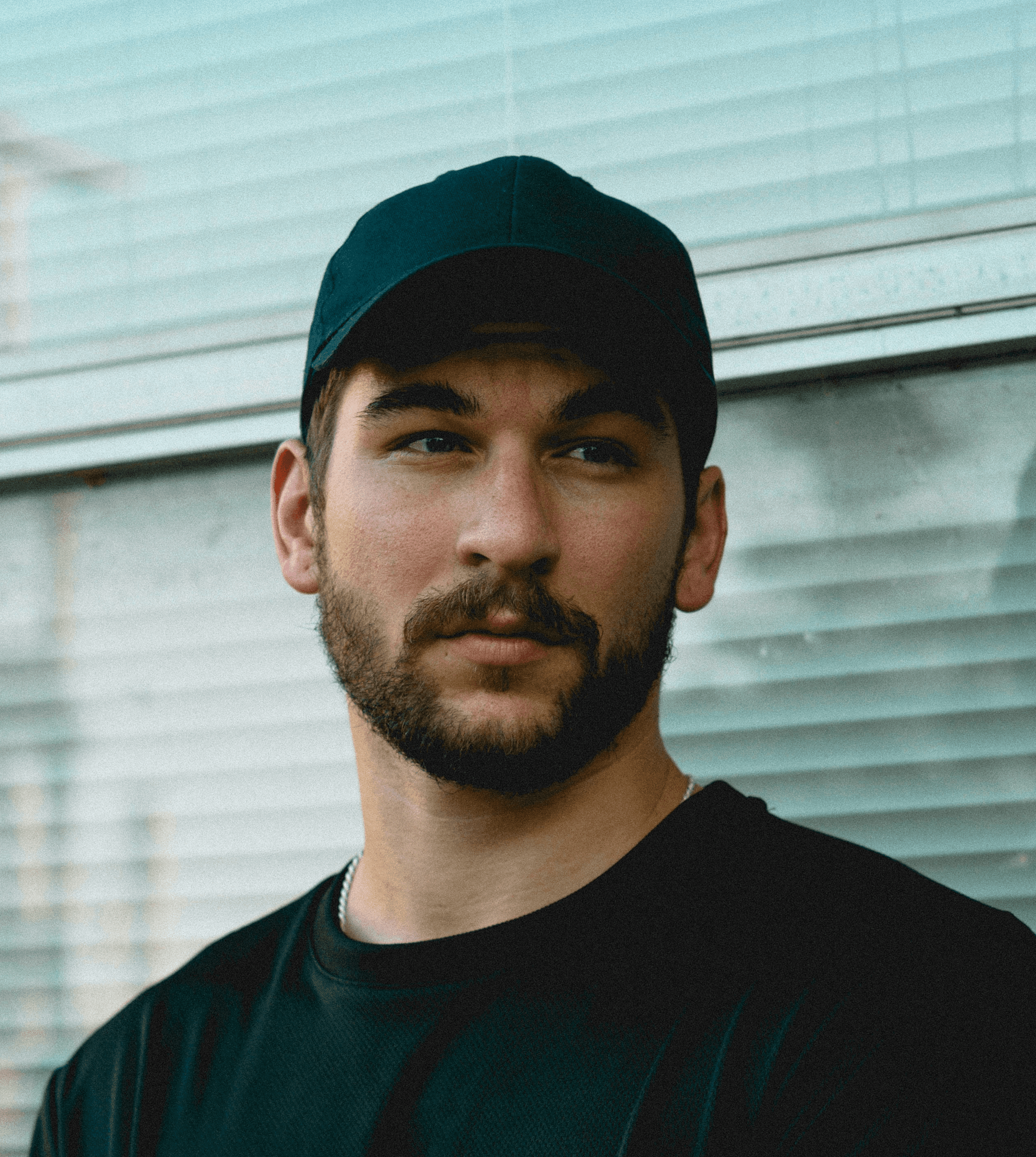 man standing in front of window