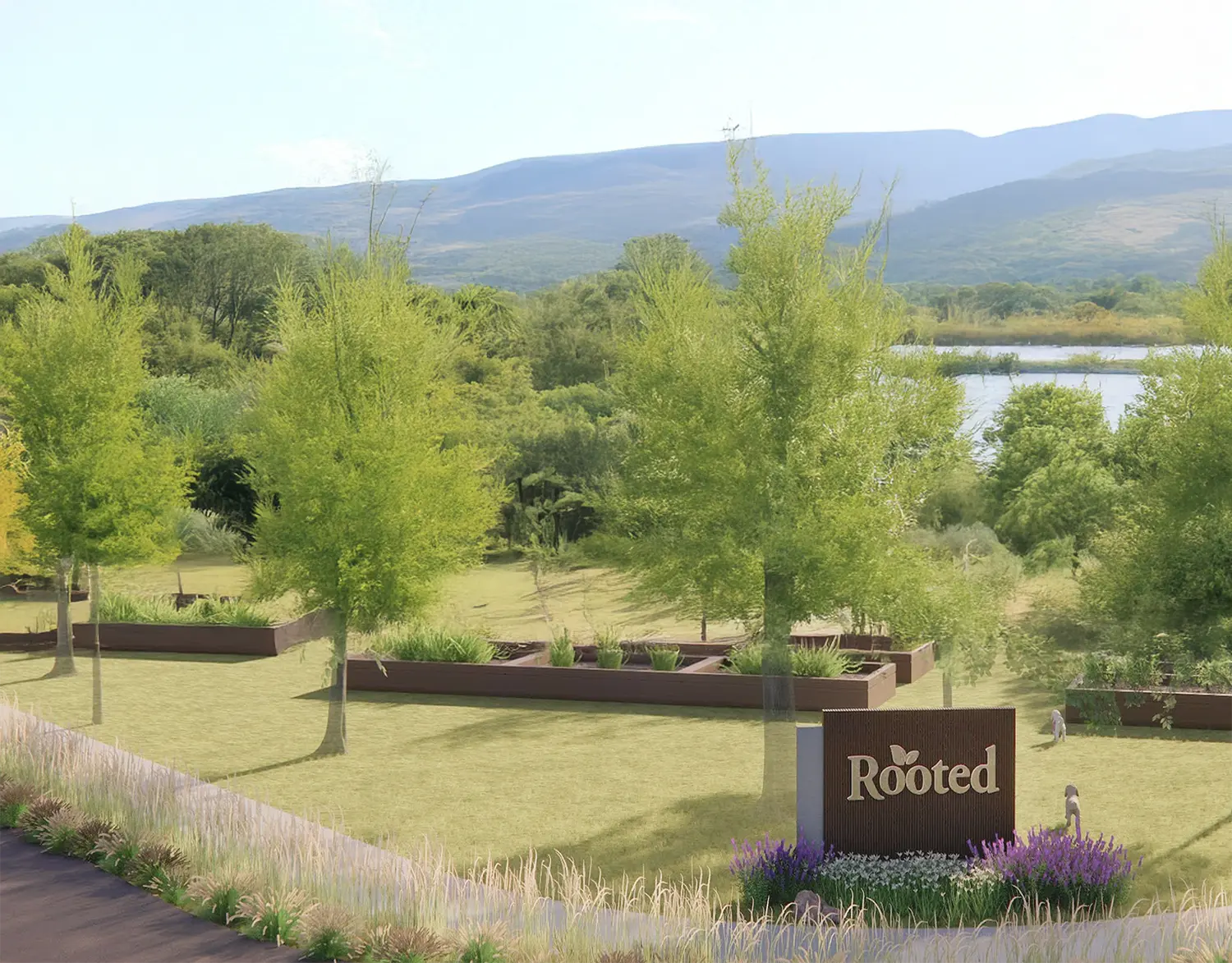 Rooted Northwest entrance sign beside landscaped native grasses and flowers, with raised garden beds and trees in the background.