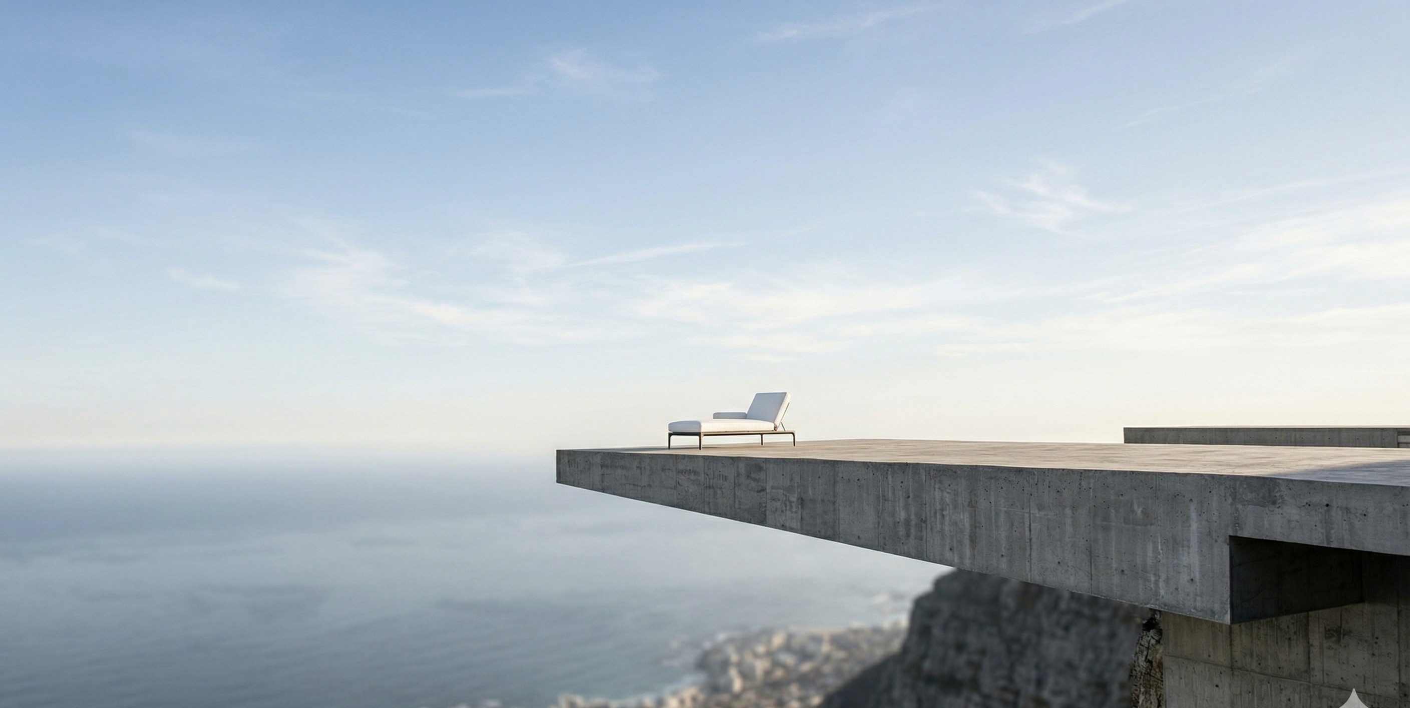 a gray couch with four pillows on it