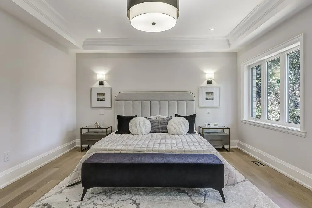 Photo of large primary bedroom.