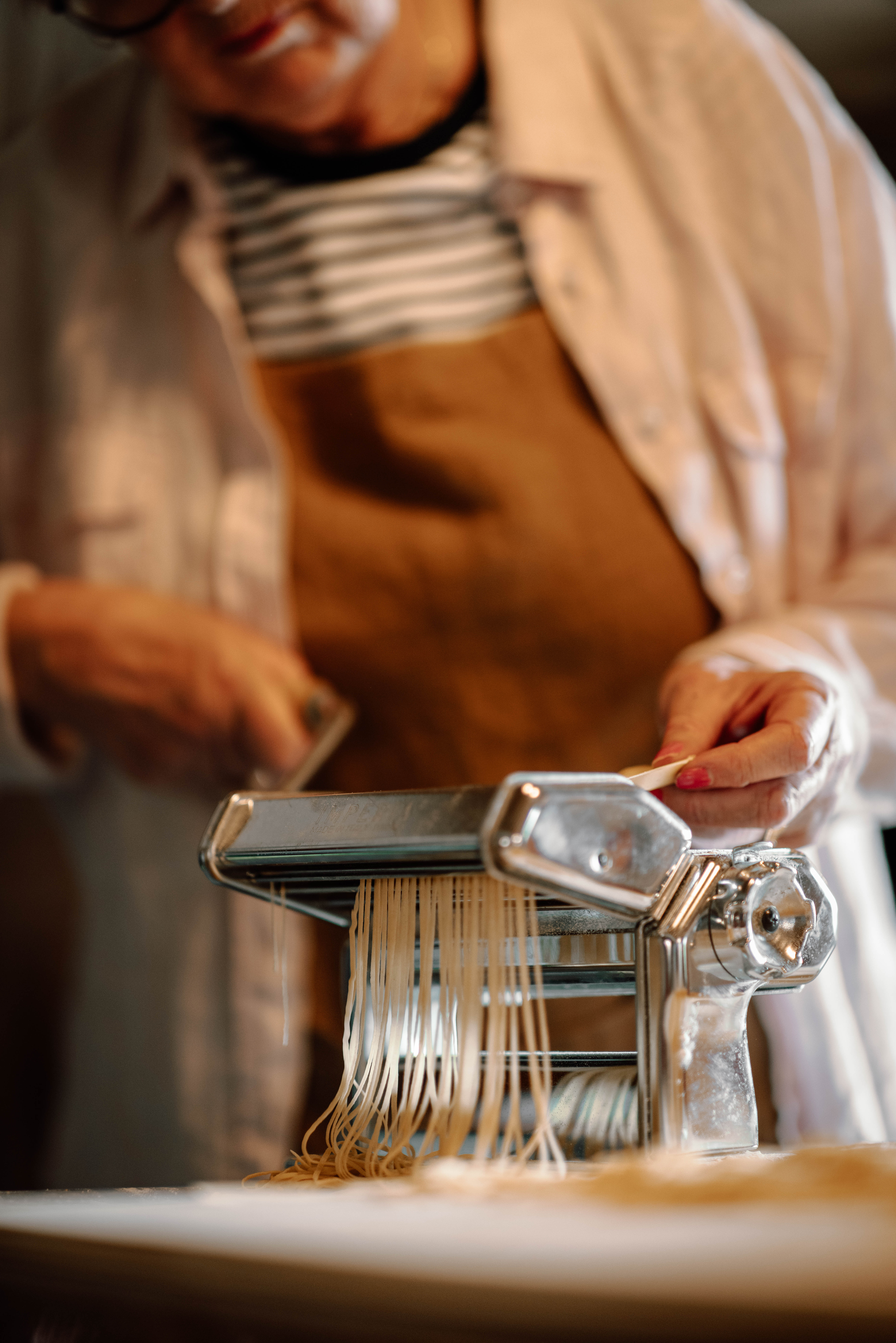 A metal sculpture of a child in a plaza.