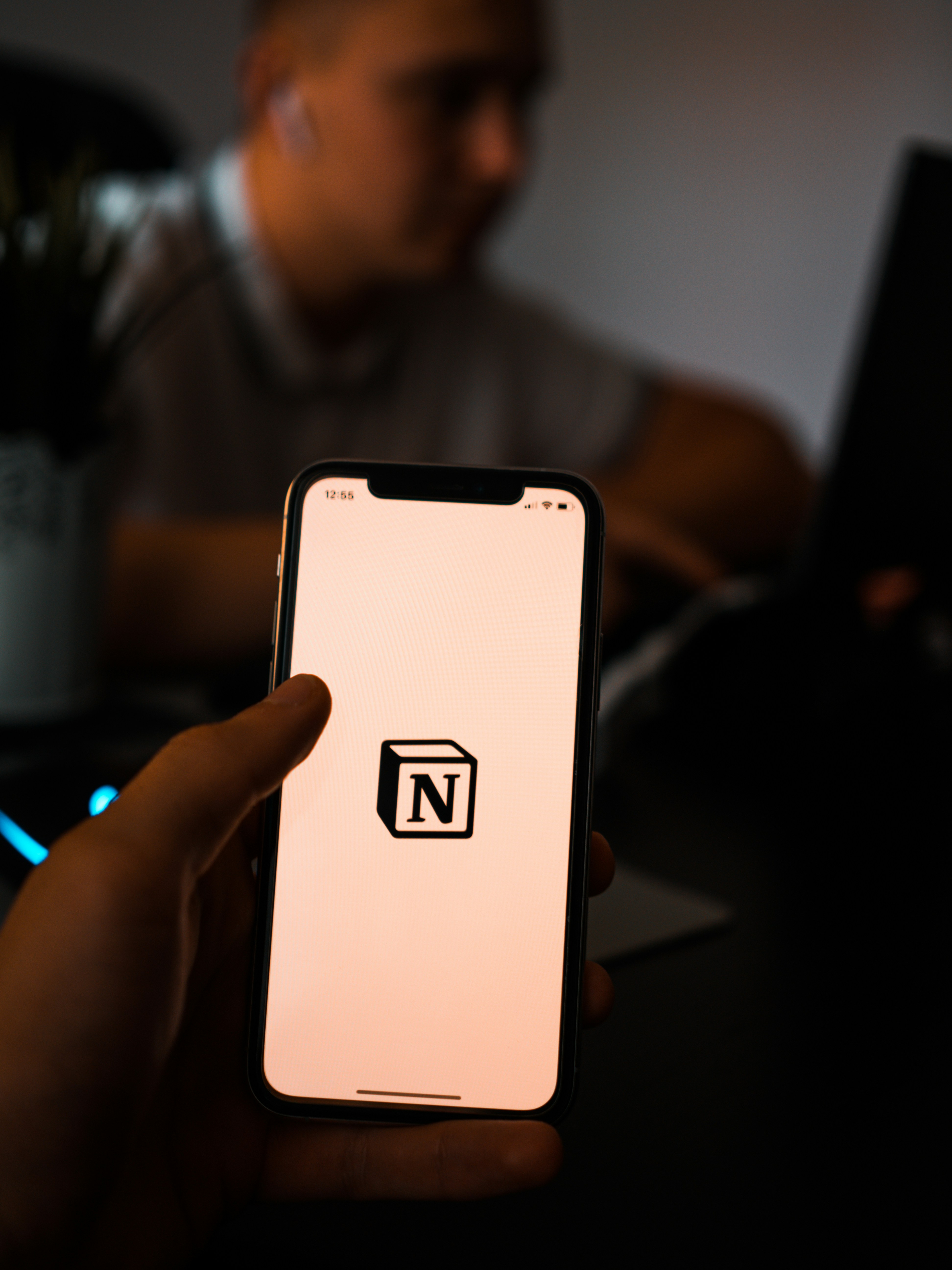 Image of a phone with the Notion logo on it