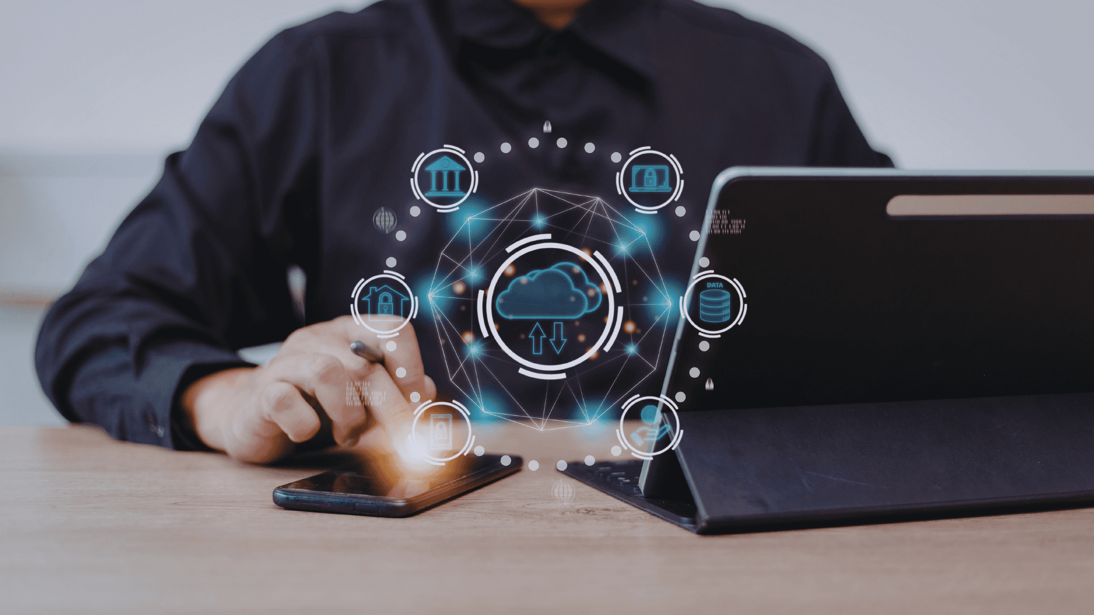 A professional working on a laptop with a smartphone on the desk, overlaid with a digital interface representing AI-driven automation and data integration.