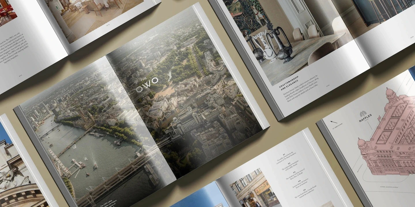 Open brochures laid out showing interior photography, architectural details and aerial views of Central London for The OWO Residences.