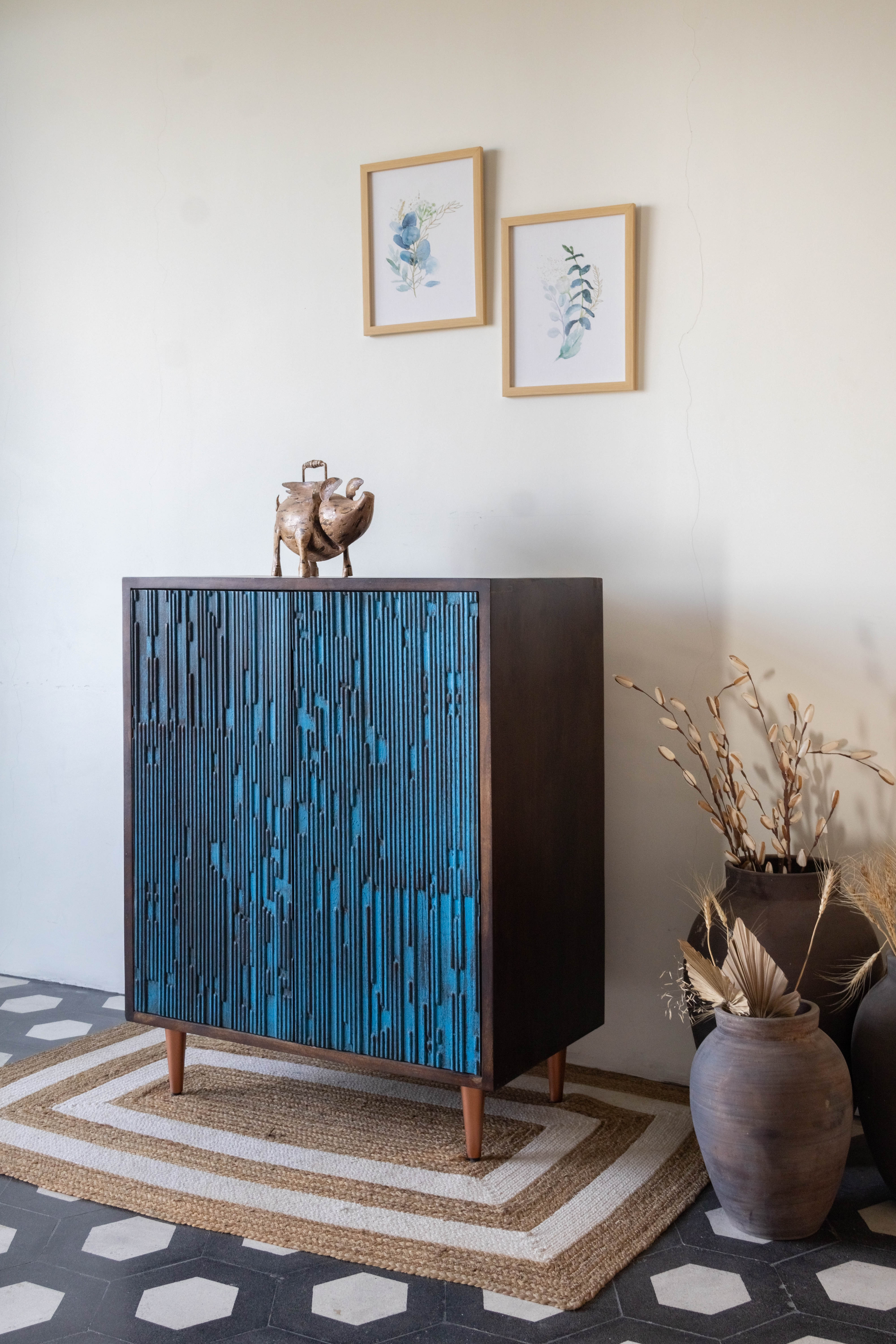 West India International Elysian collection made with deep blue tone of wood and chrome finished elements