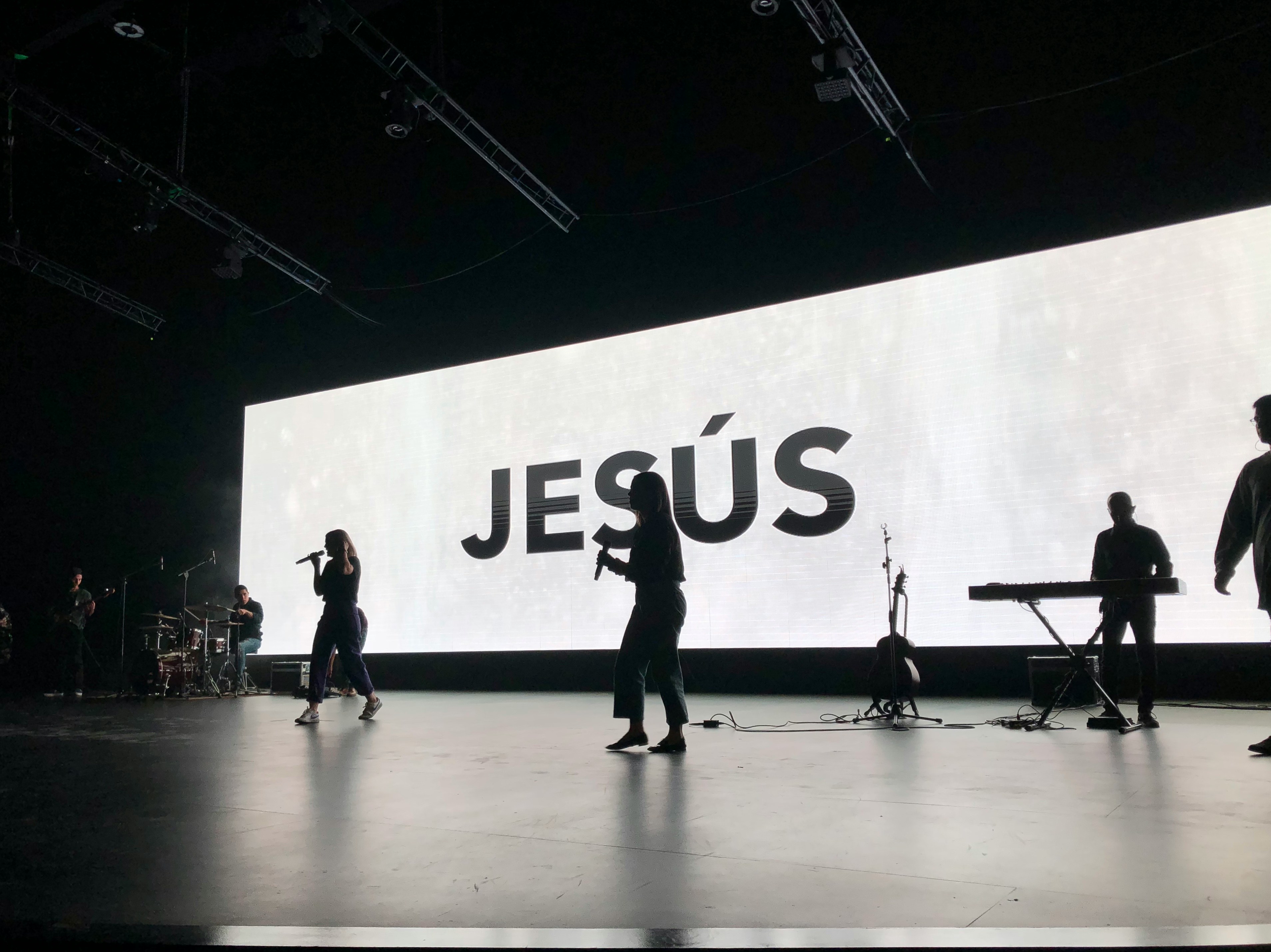 a group of people standing on top of a stage