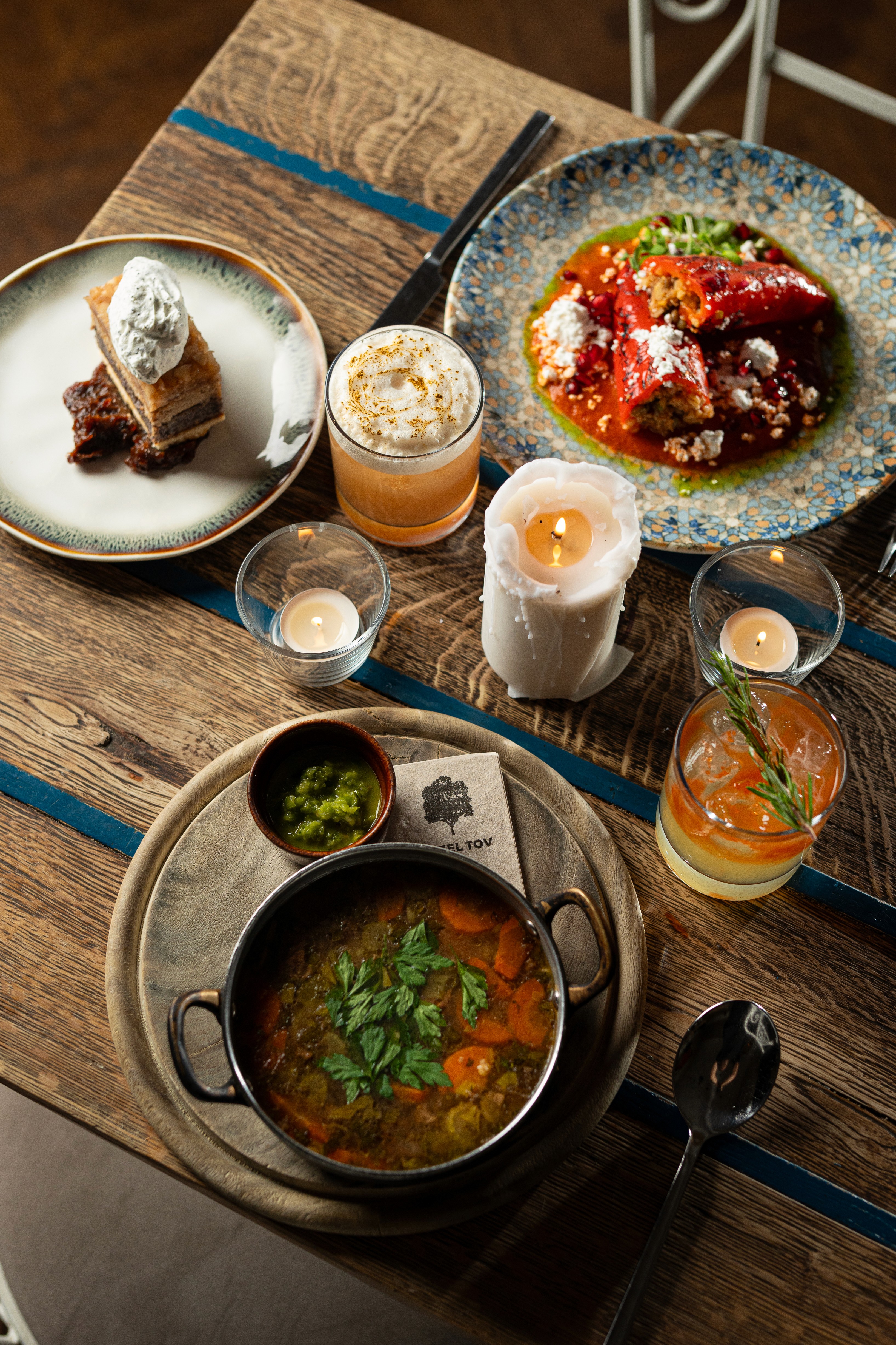 People sharing food at Mazeltov restaurant