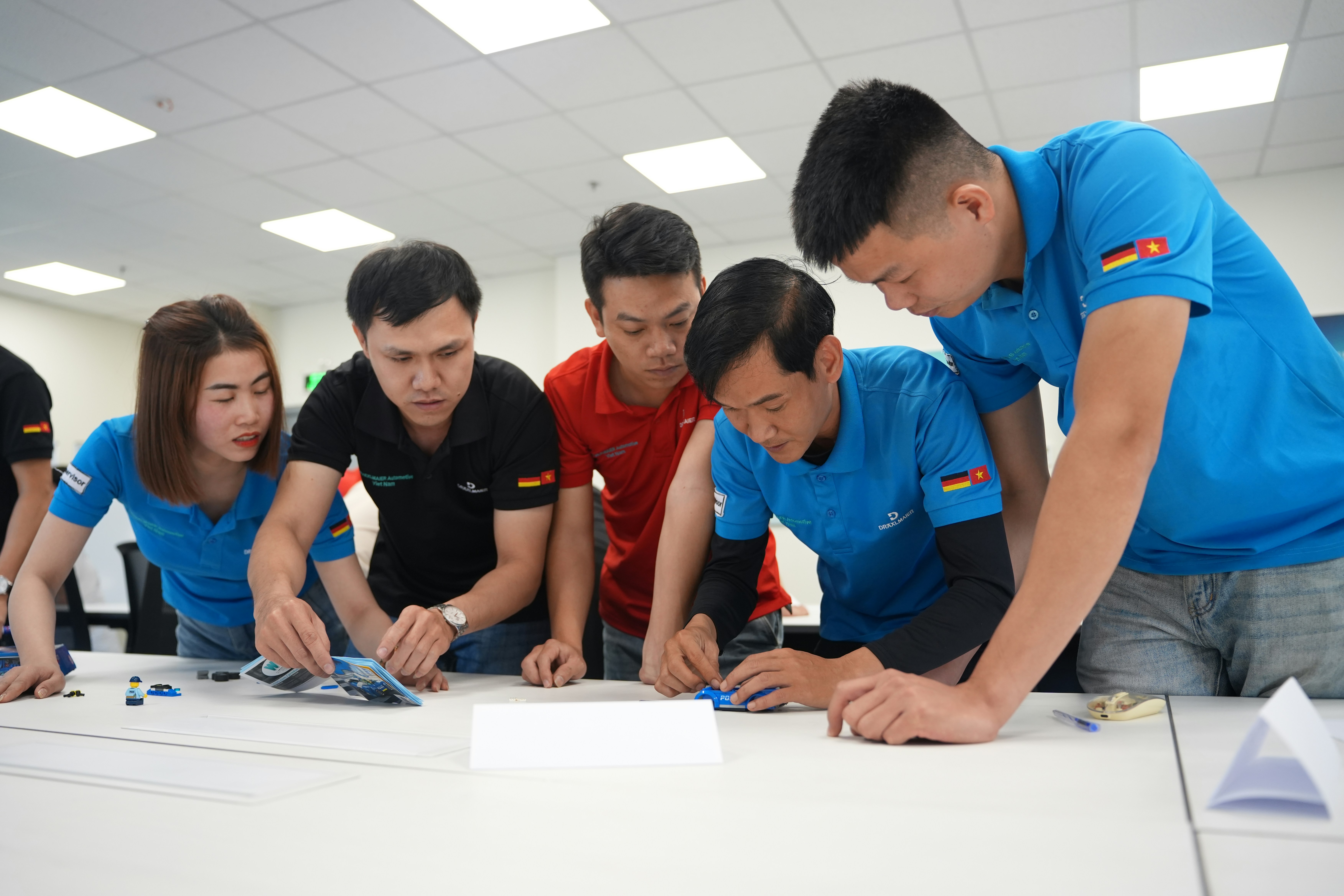 Group of People, likely engineers, working on a project