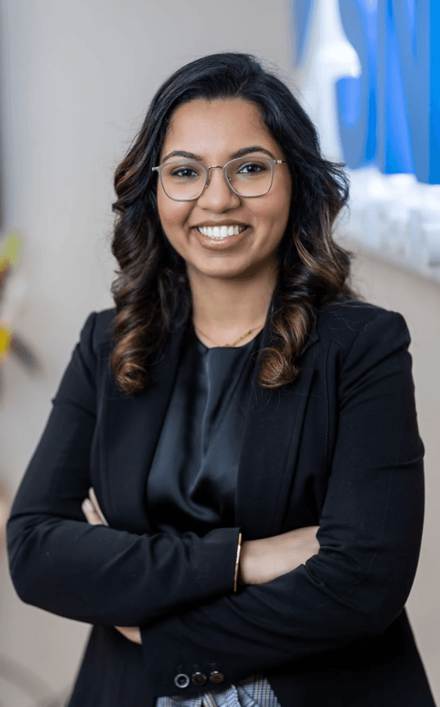 Dr. Simrann Rai Sethi smiling in the Milltown dental office