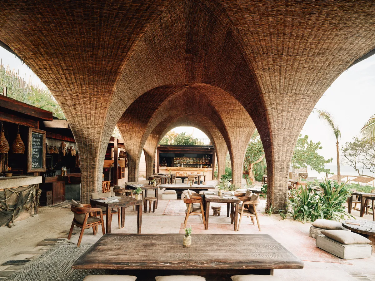 La Popular restaurant at Nômade Holbox, Holbox Mexico, with dining tables, bar and beachfront view
