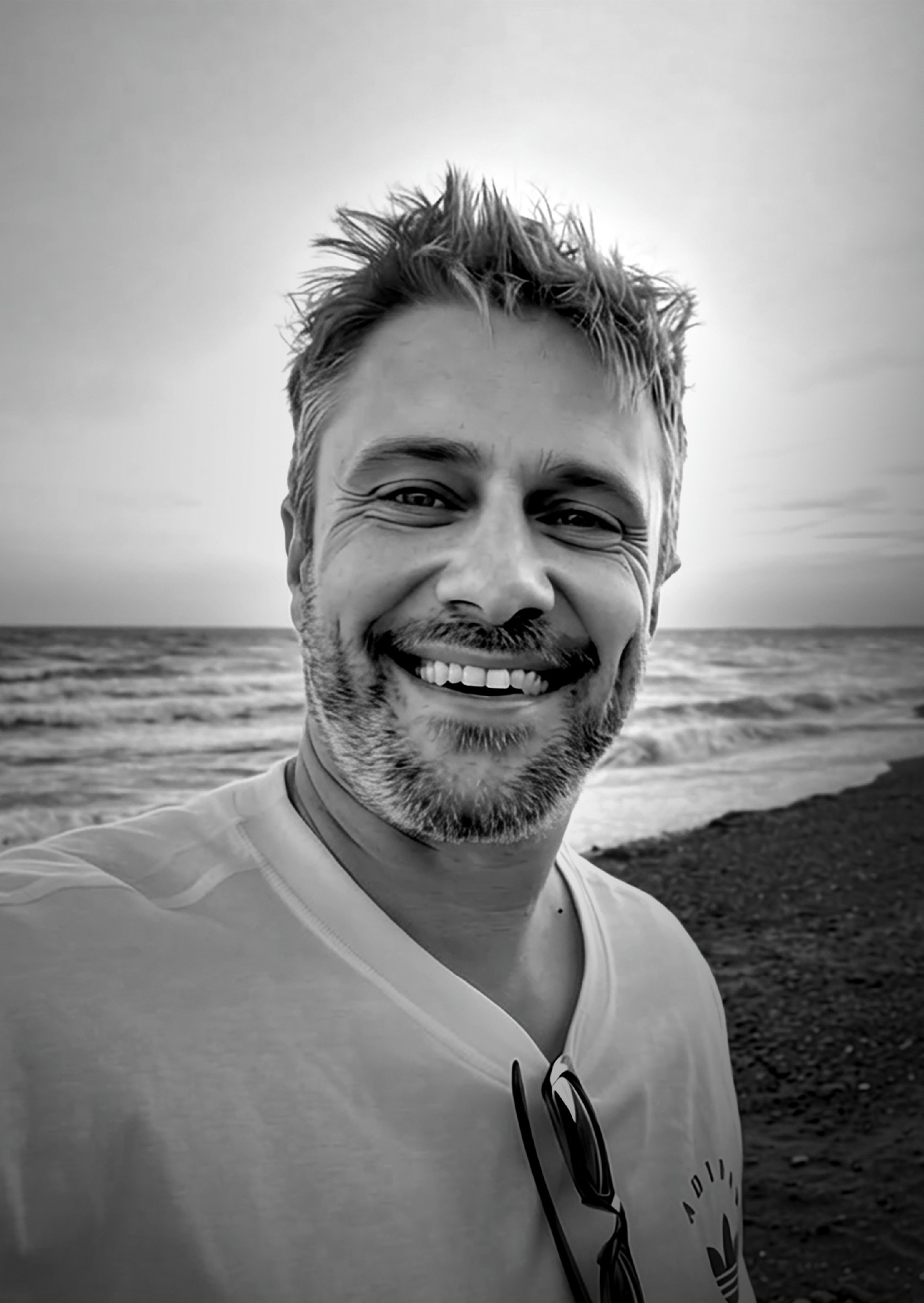 man in black knit cap and black framed eyeglasses
