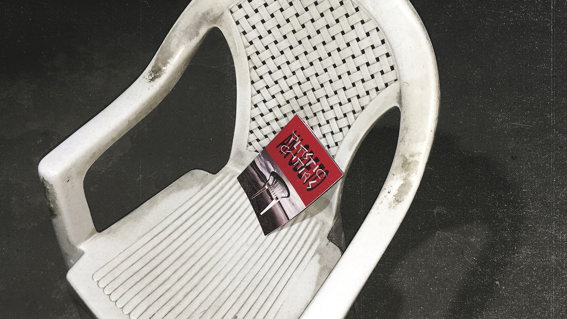 booklet about plastic chairs on a plastic chair