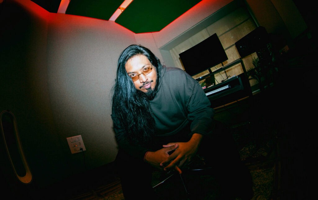 Man performing with guitar on stage