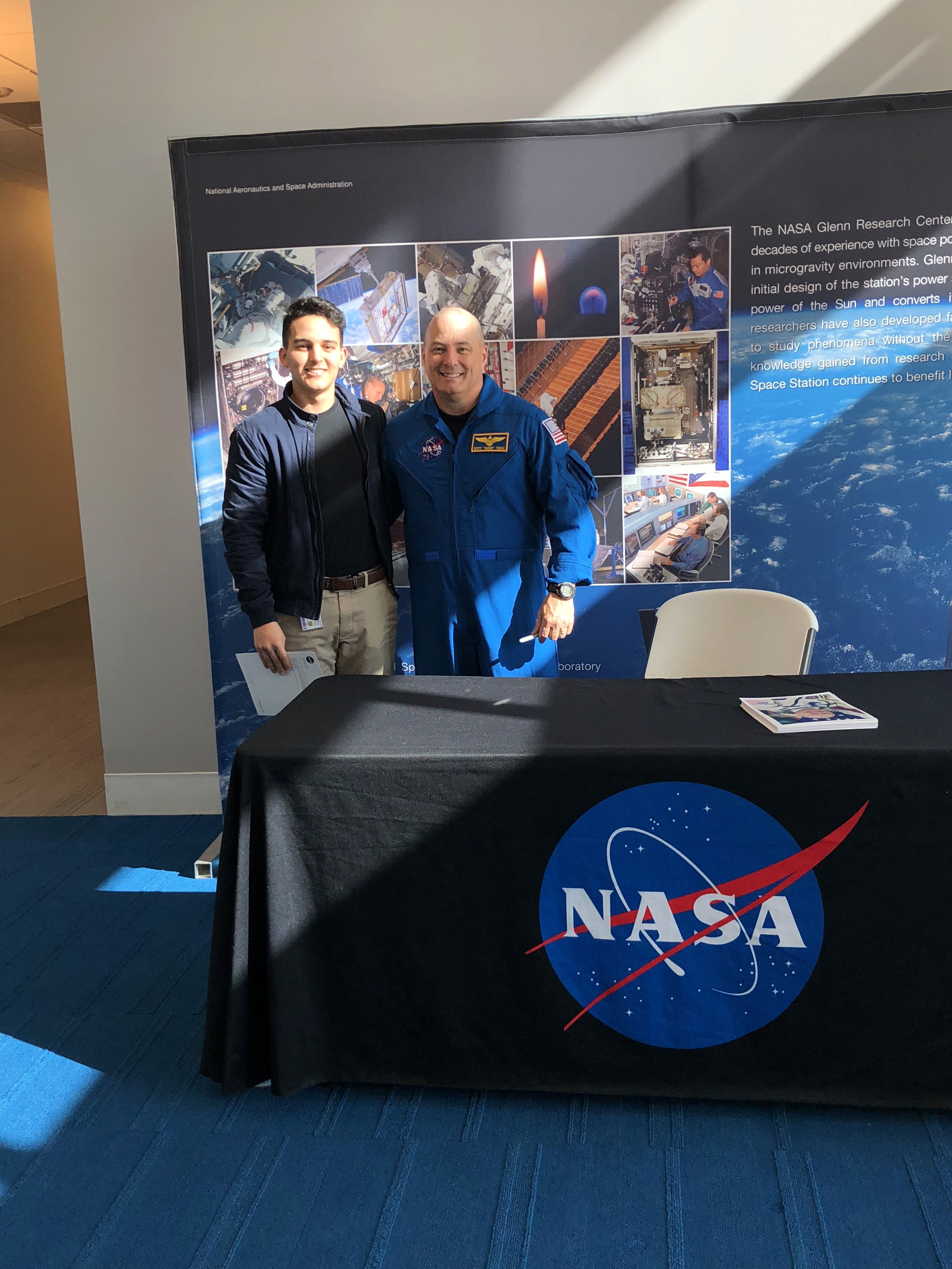 a group of people walking on a sidewalk