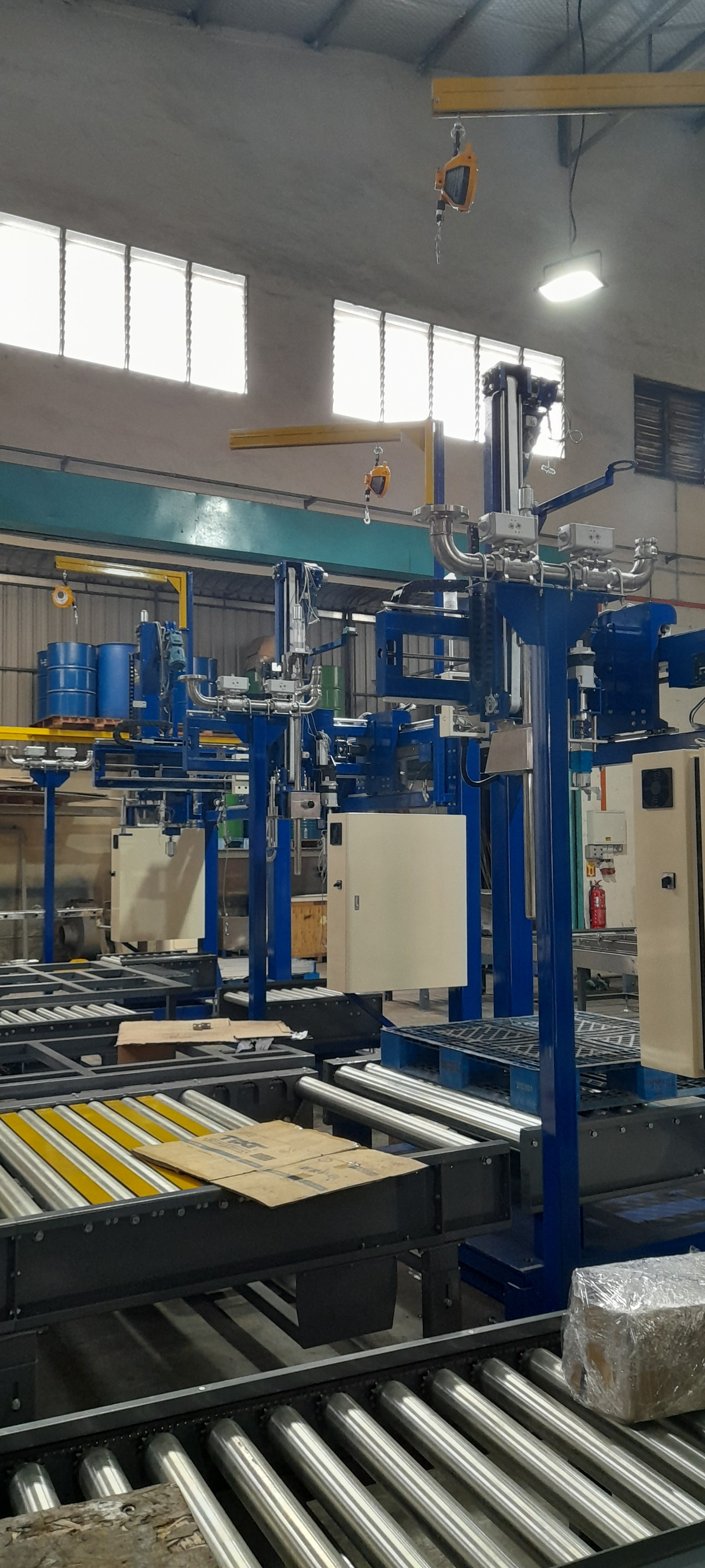 Assembly of the main filling machine structure on the workshop floor.	