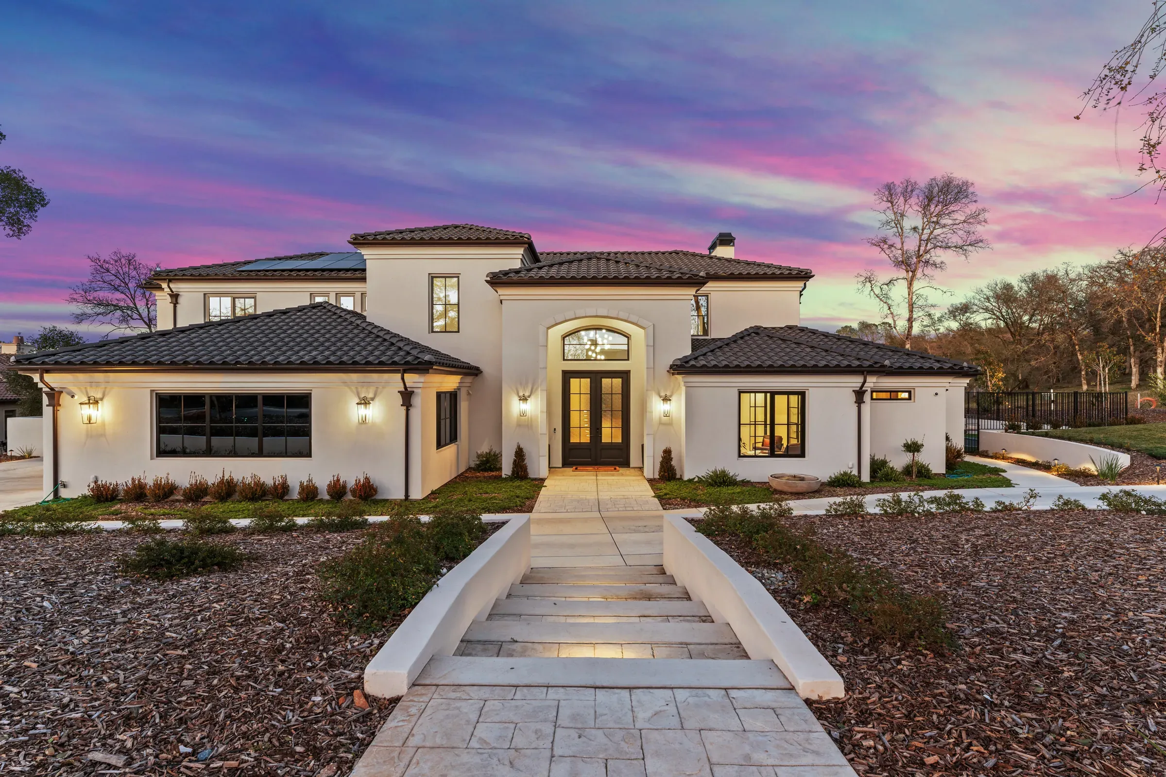 Custom home built by ERC, front entry at dusk