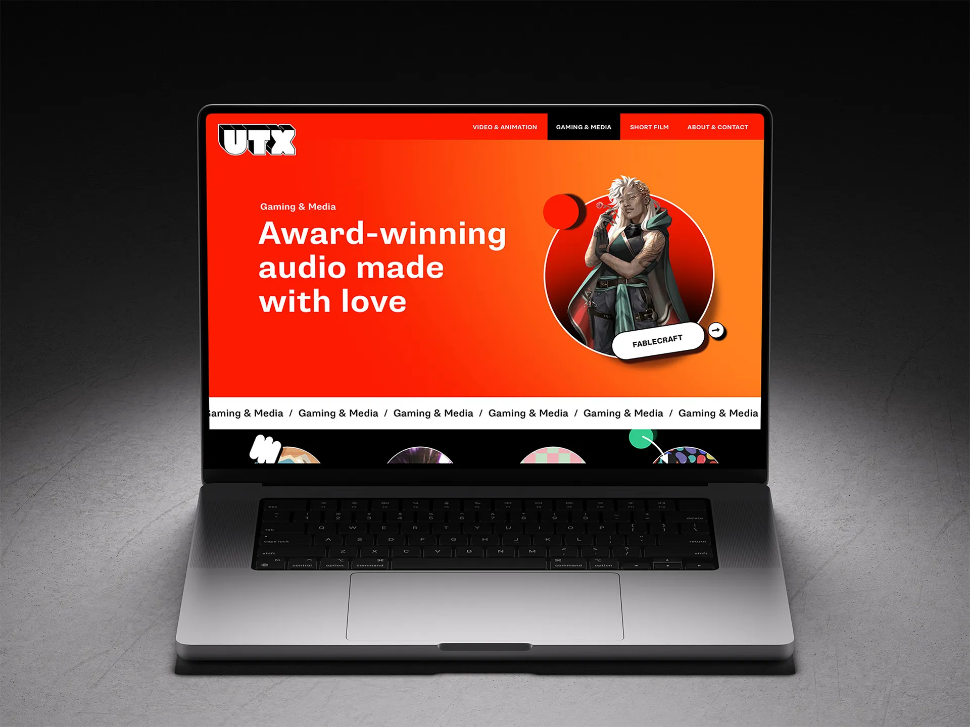 A laptop displays a bright red screen with promotional content featuring a speaking individual.