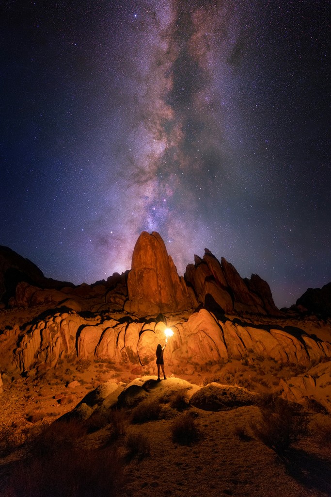 The milky way over a rocky landscape