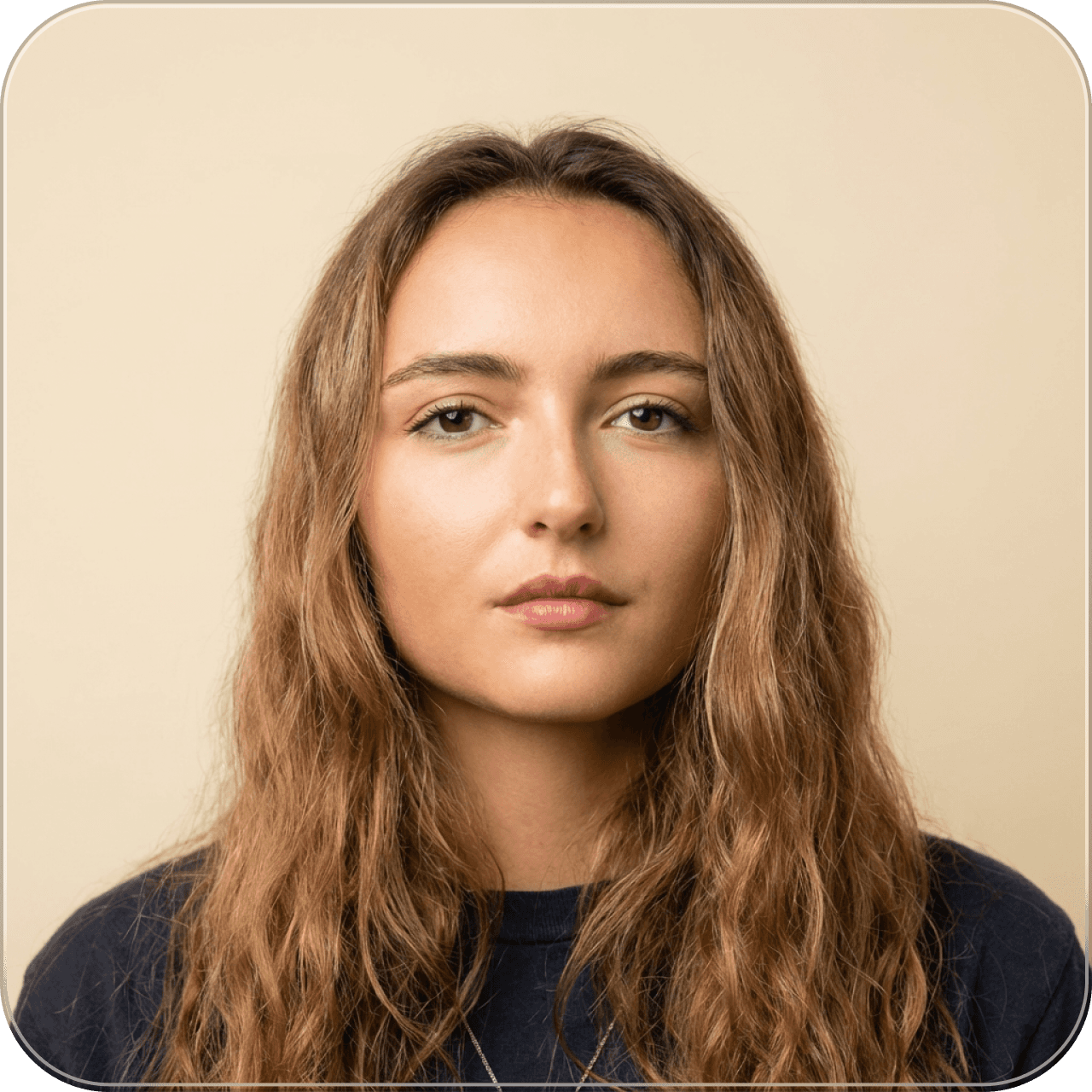 A woman sitting on a couch with a laptop