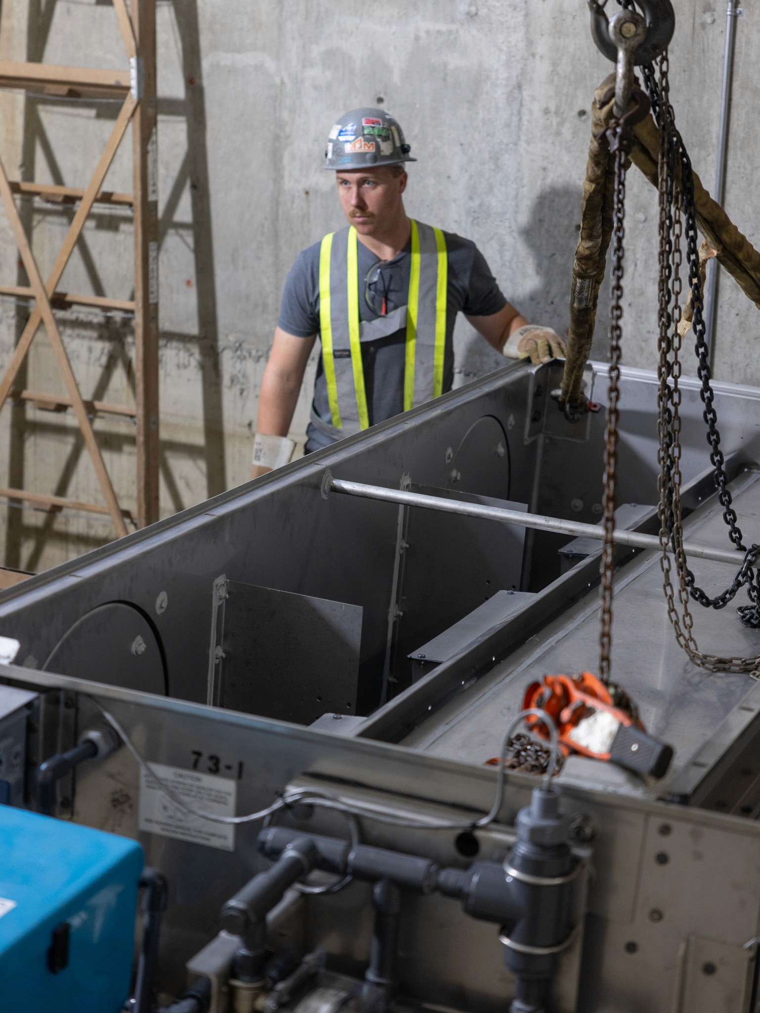 Chilliwack HVAC and plumbing expert installing industrial equipment in Fraser Valley, British Columbia.