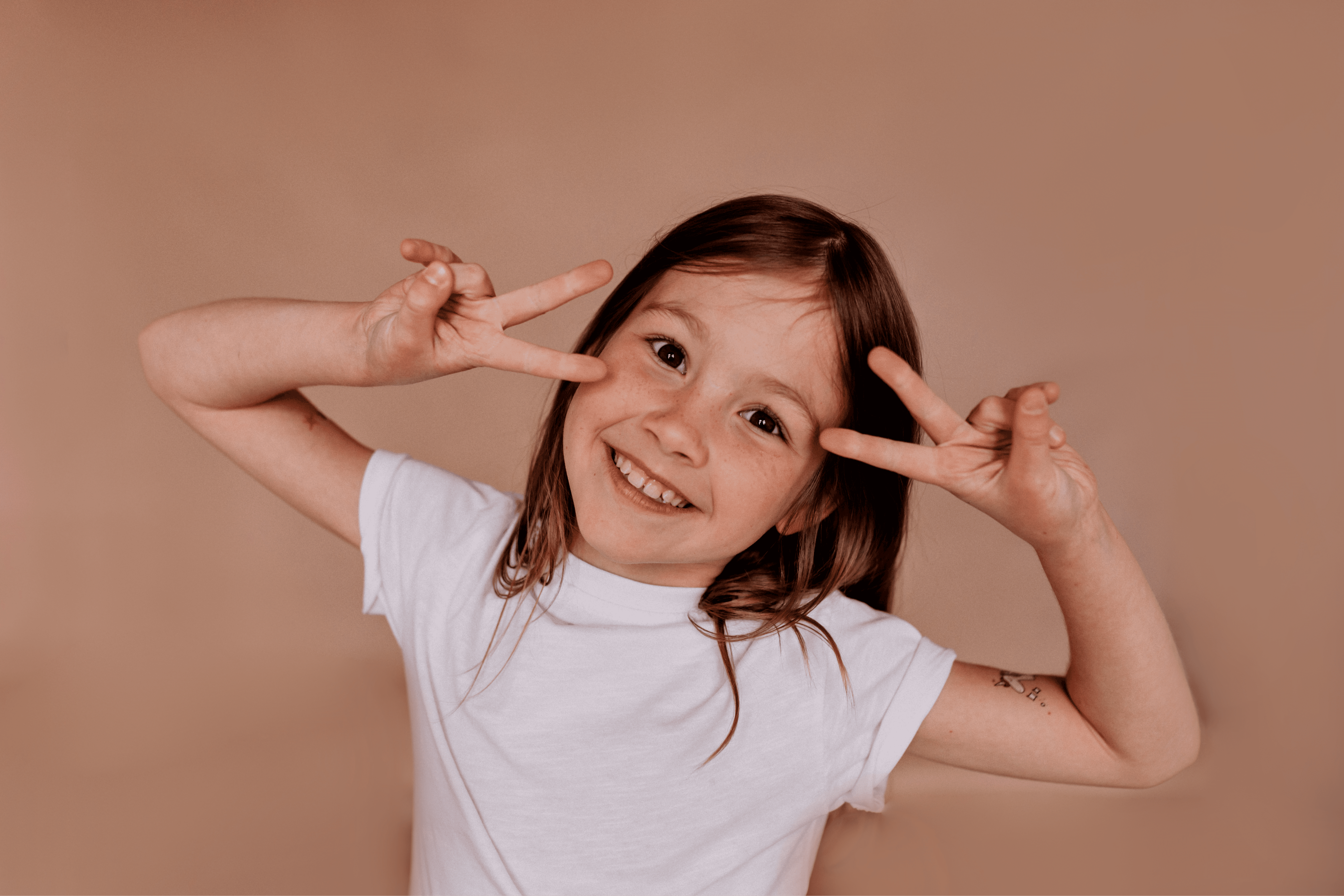 a close up of a child brushing her teeth