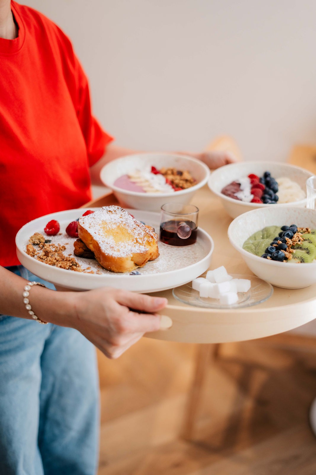 Posh restaurant interior with blue walls and large chandelier in the center