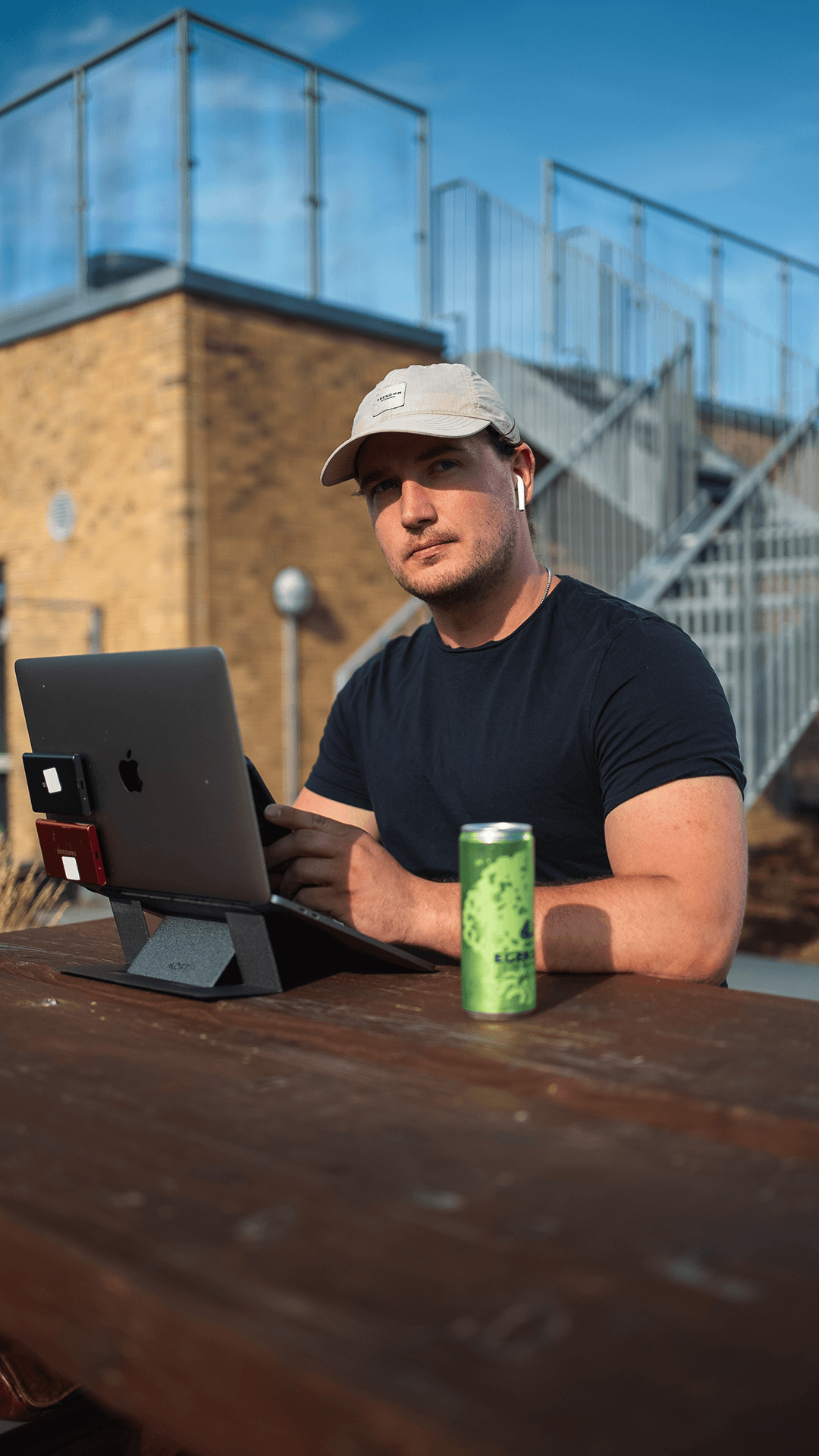 Open book on a gray surface, featuring vibrant red, orange, and teal smoke against dark pages. Text and numbers are scattered, creating a dynamic, modern feel.