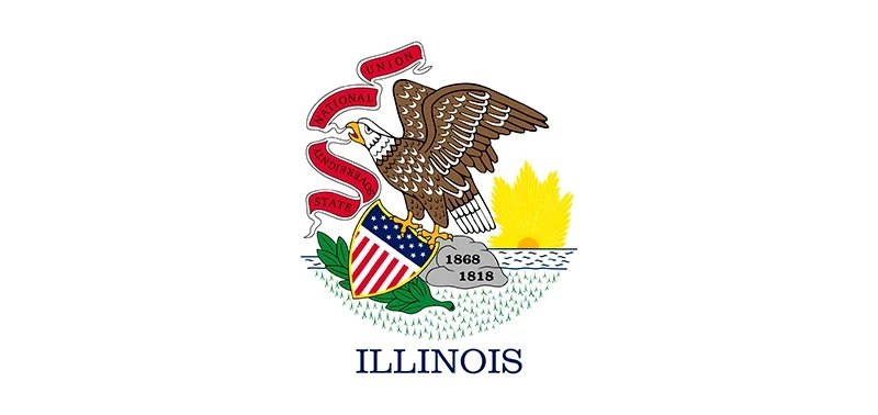 The image shows the Illinois state flag featuring a bald eagle perched on a shield with stars and stripes. The eagle holds a banner with "State Sovereignty, National Union." Below, "Illinois" is written in blue.