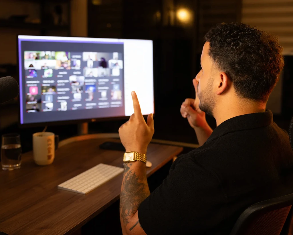 woman in gray coat singing on stage