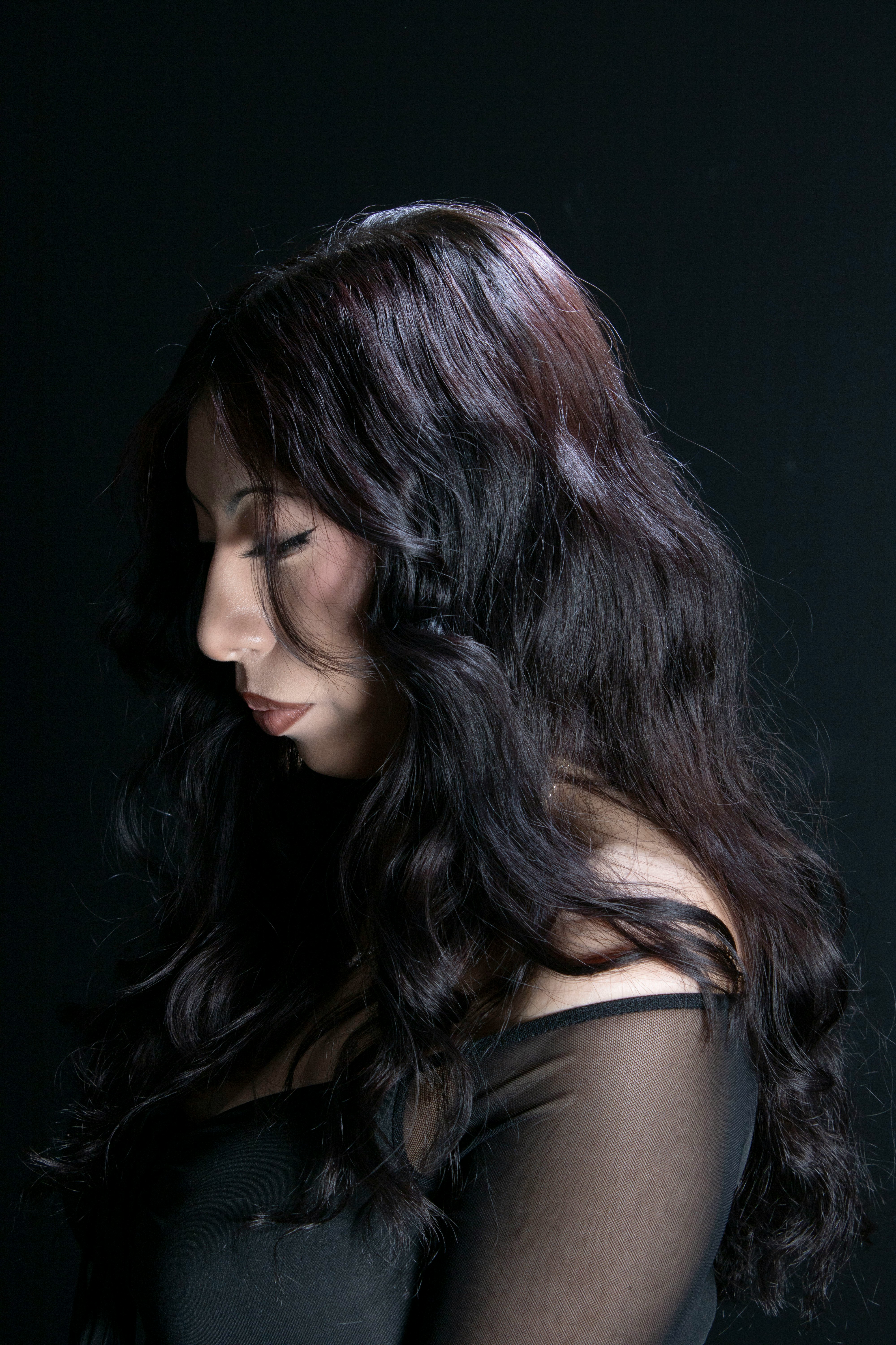 A woman in a black dress posing for a picture