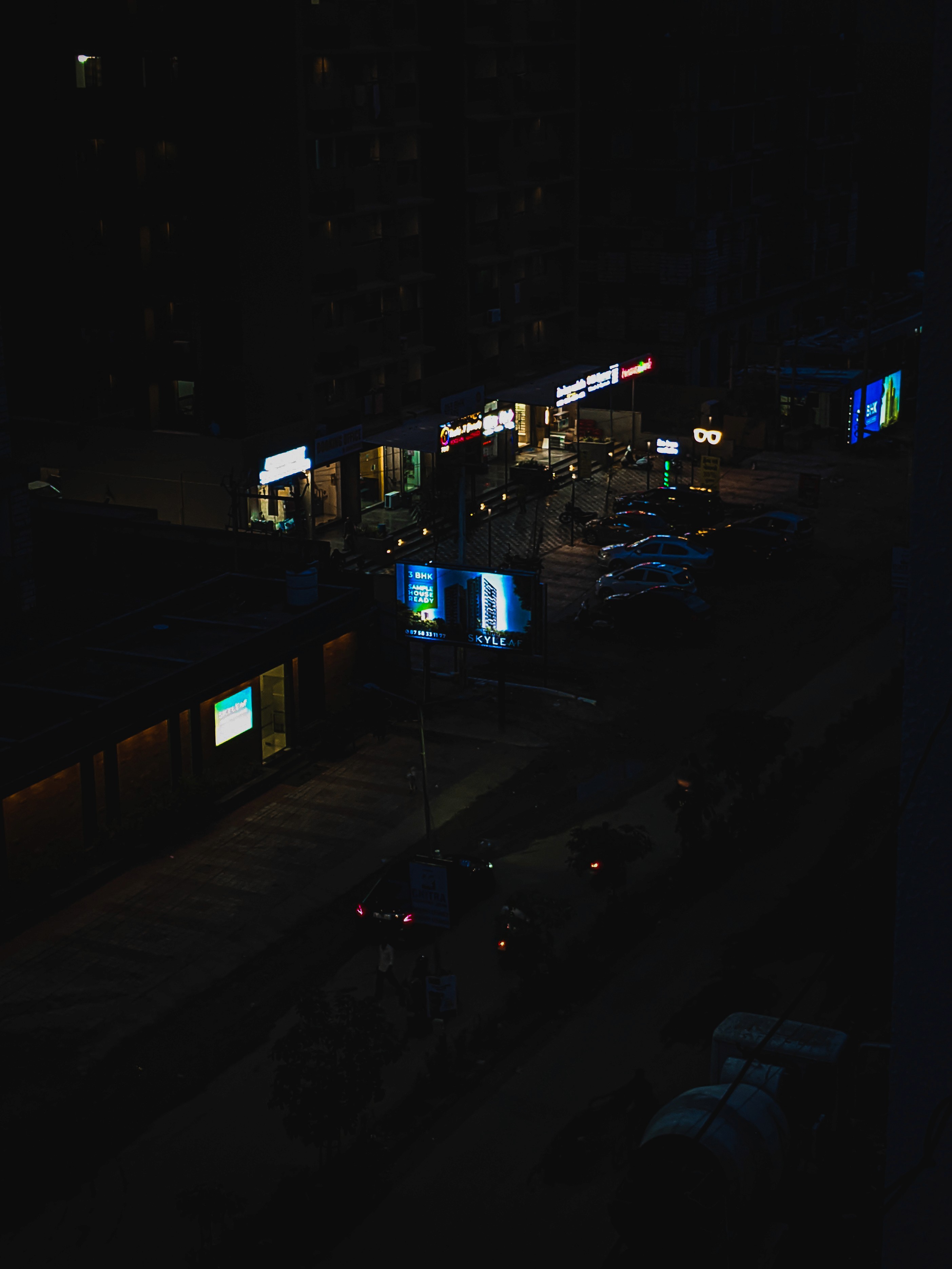 Street photography at night with neon lights and cinematic mood, urban shot by Samuel Singh Bhakuni.