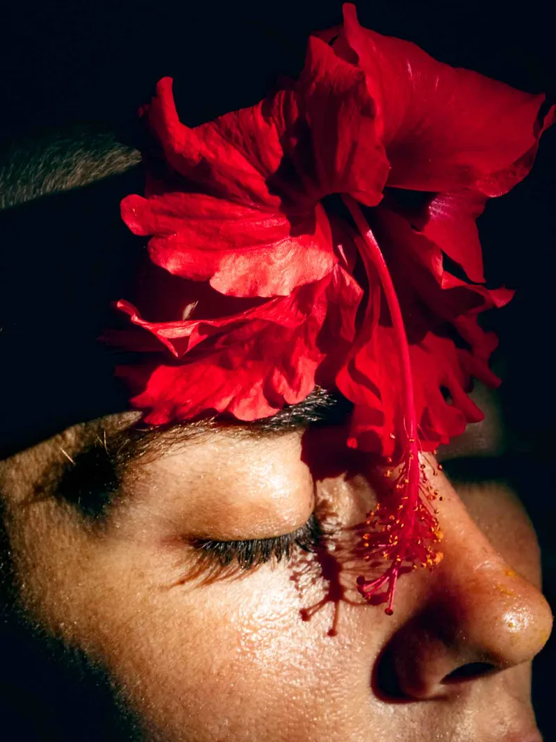 Guest relaxing on the beach, soaking up the sun and enjoying the ocean views at Nomade Holbox in Tulum Mexico