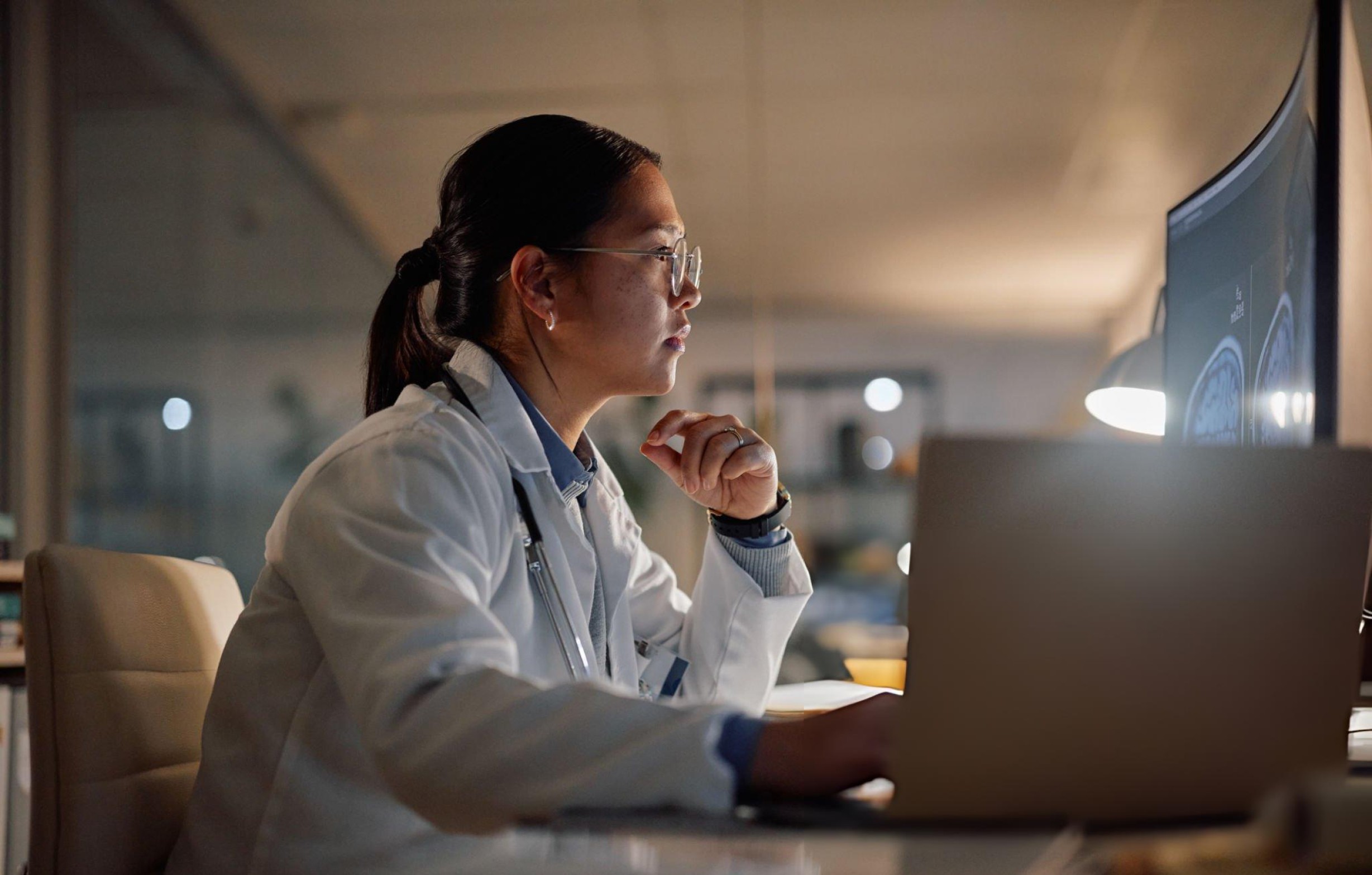 person writing on a piece of paper 
