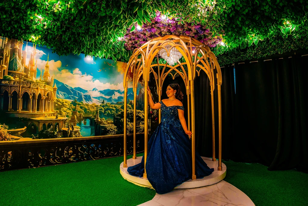 Debutante in a navy gown inside the golden gazebo at Pandora Hall, Stalla Suites QC