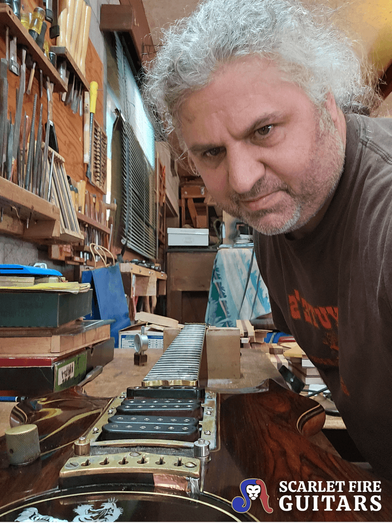 Leo Elliot with Jerry Garcia's Tiger guitar on the workbench, Doug Irwin's shop