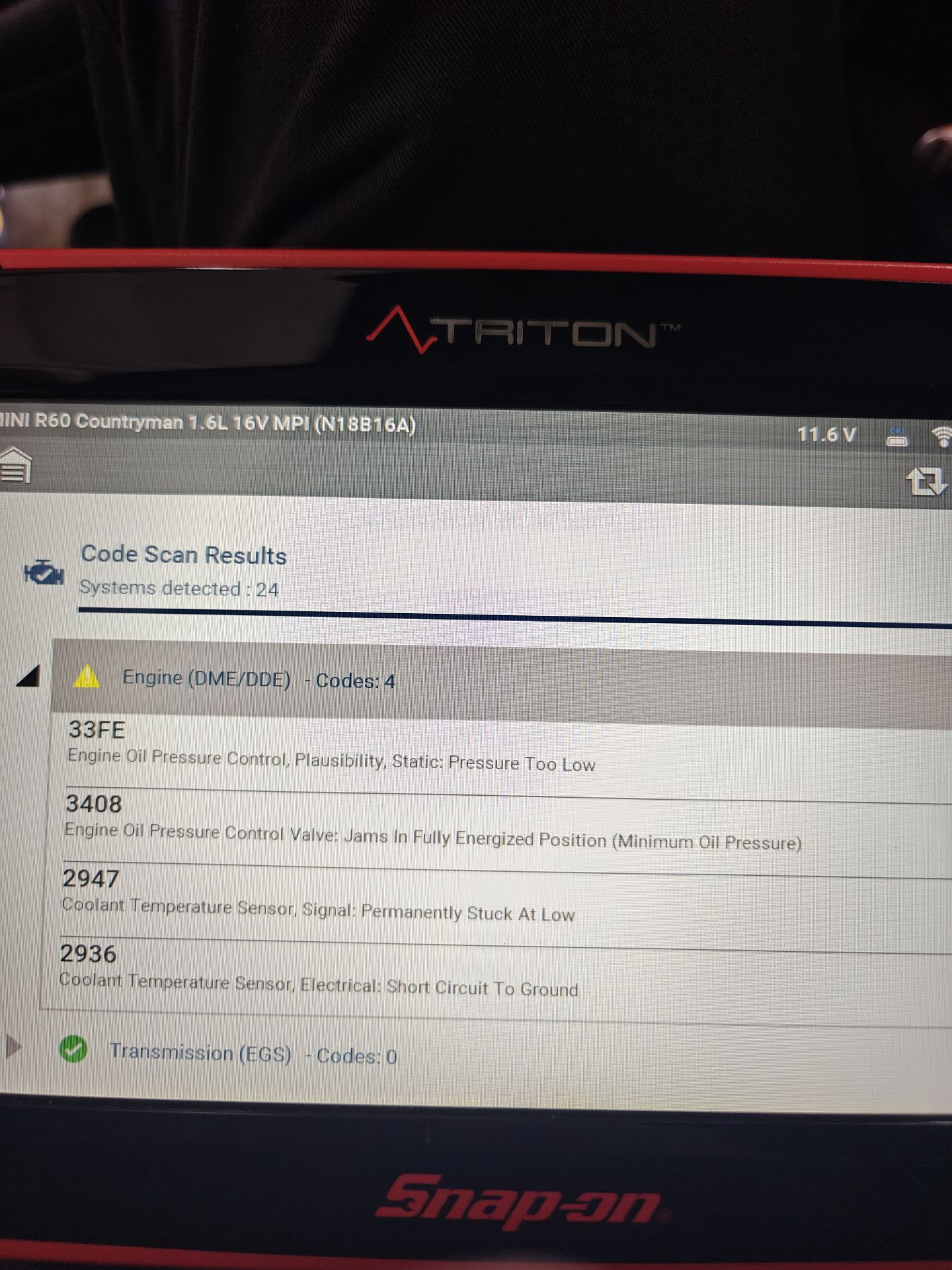 Snap-on scan tool showing four engine codes on the MINI Countryman: two for oil pressure and two for the coolant temperature sensor