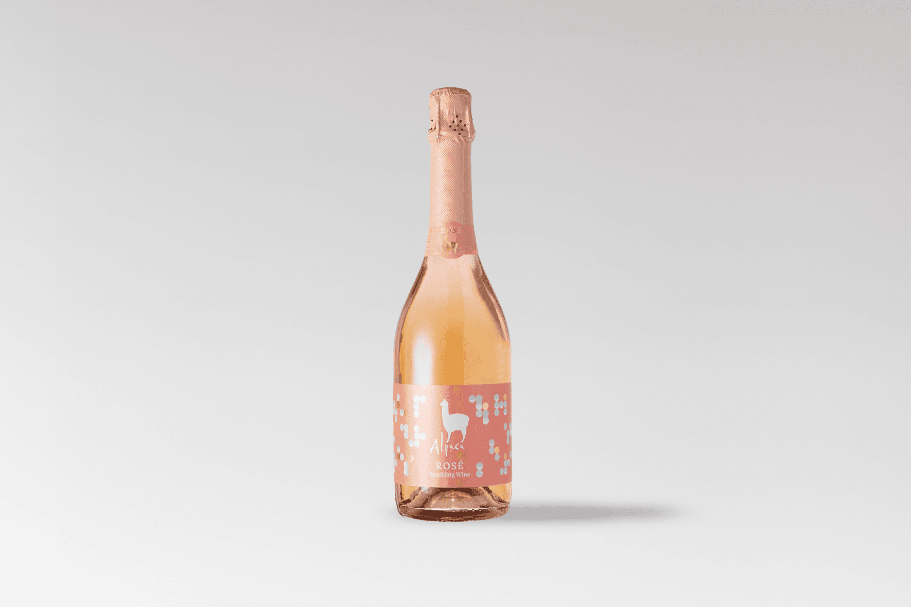 Single Alpaca Rose Sparkling bottle with pink packaging on a neutral background.