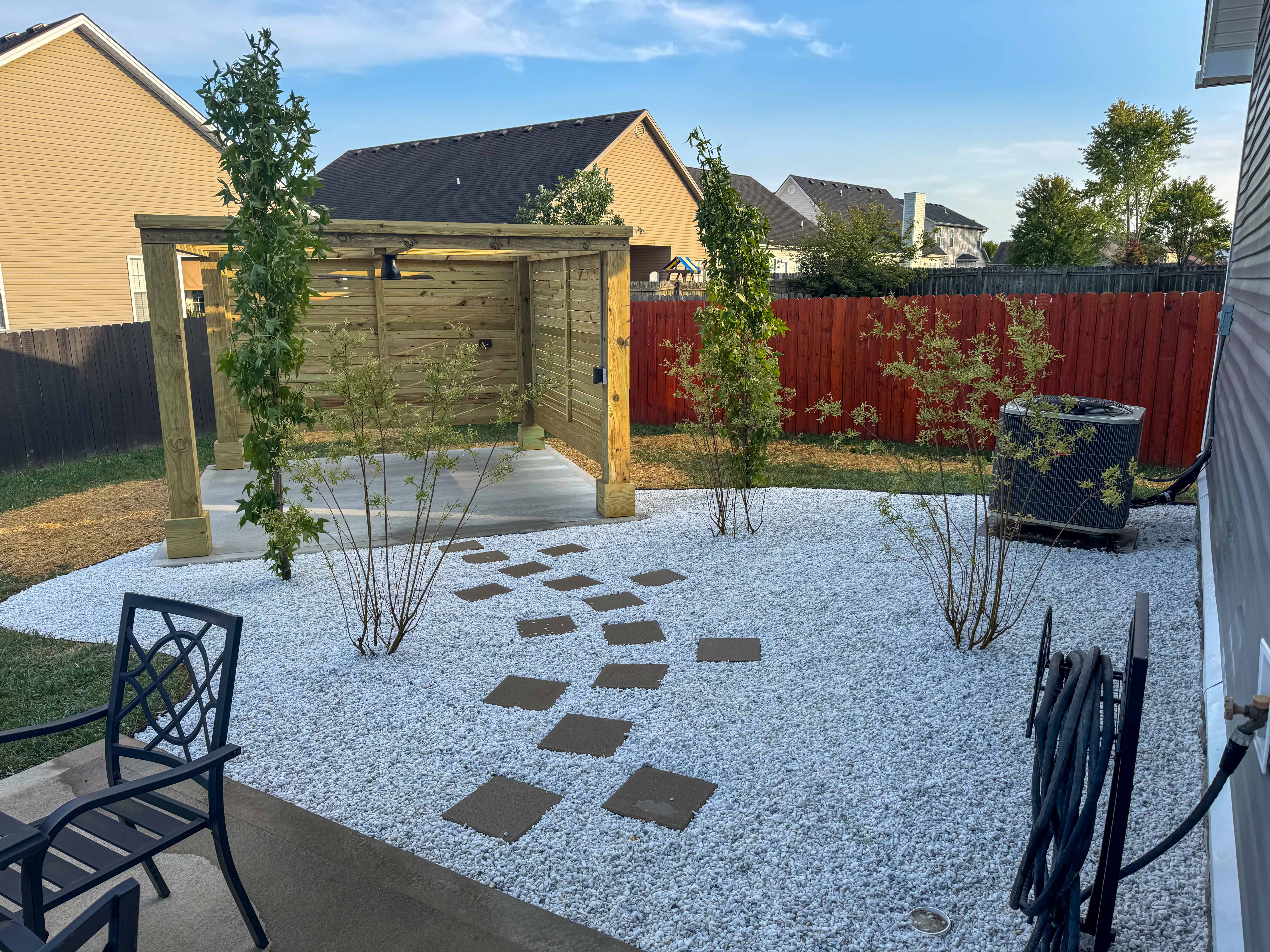 Side view of wood pavilion and modern gravel landscaping