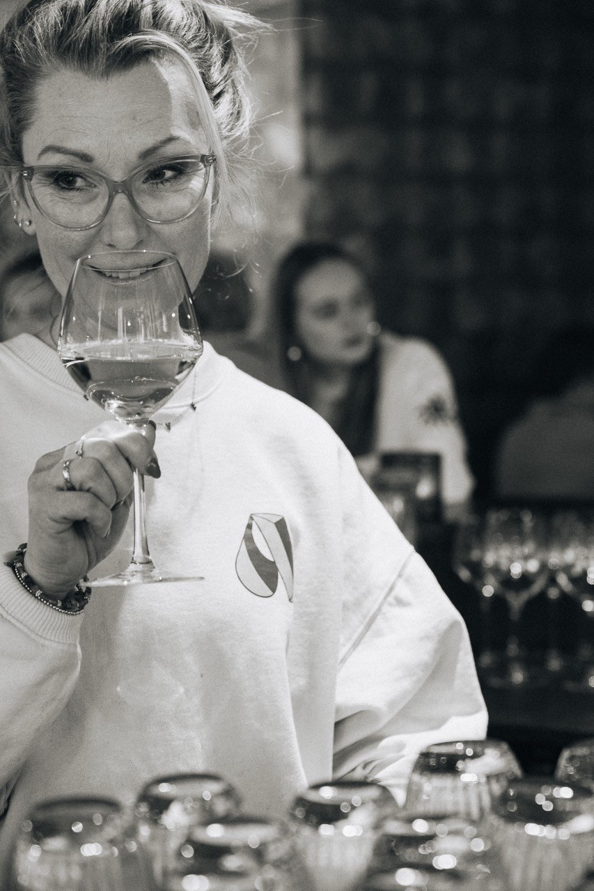 woman tasting wine in a restaurant