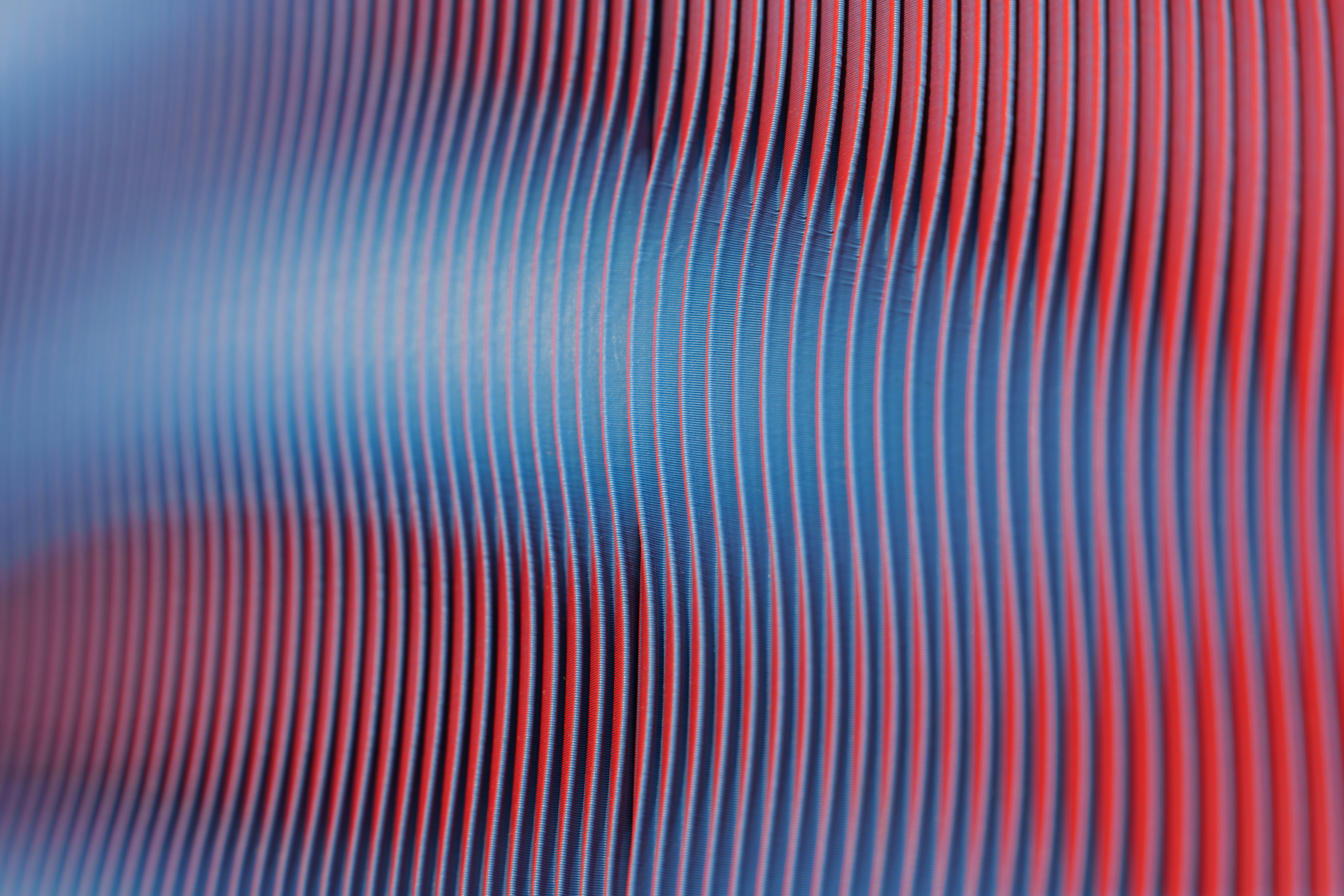 Red and blue wavy lines create an abstract design.