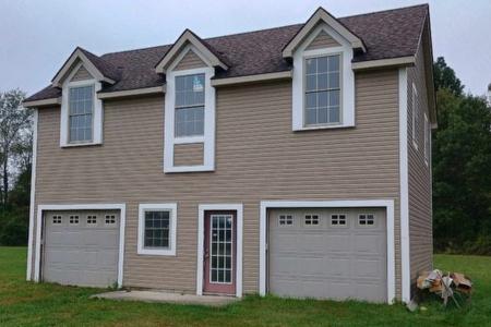 Two door garage with upstairs loft construction in the city of Milford.