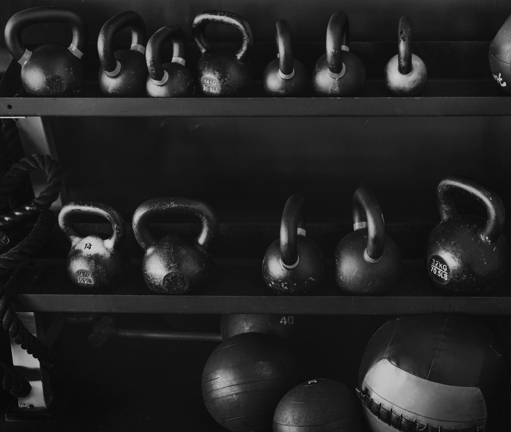 Woman practicing aerial yoga with white hammock