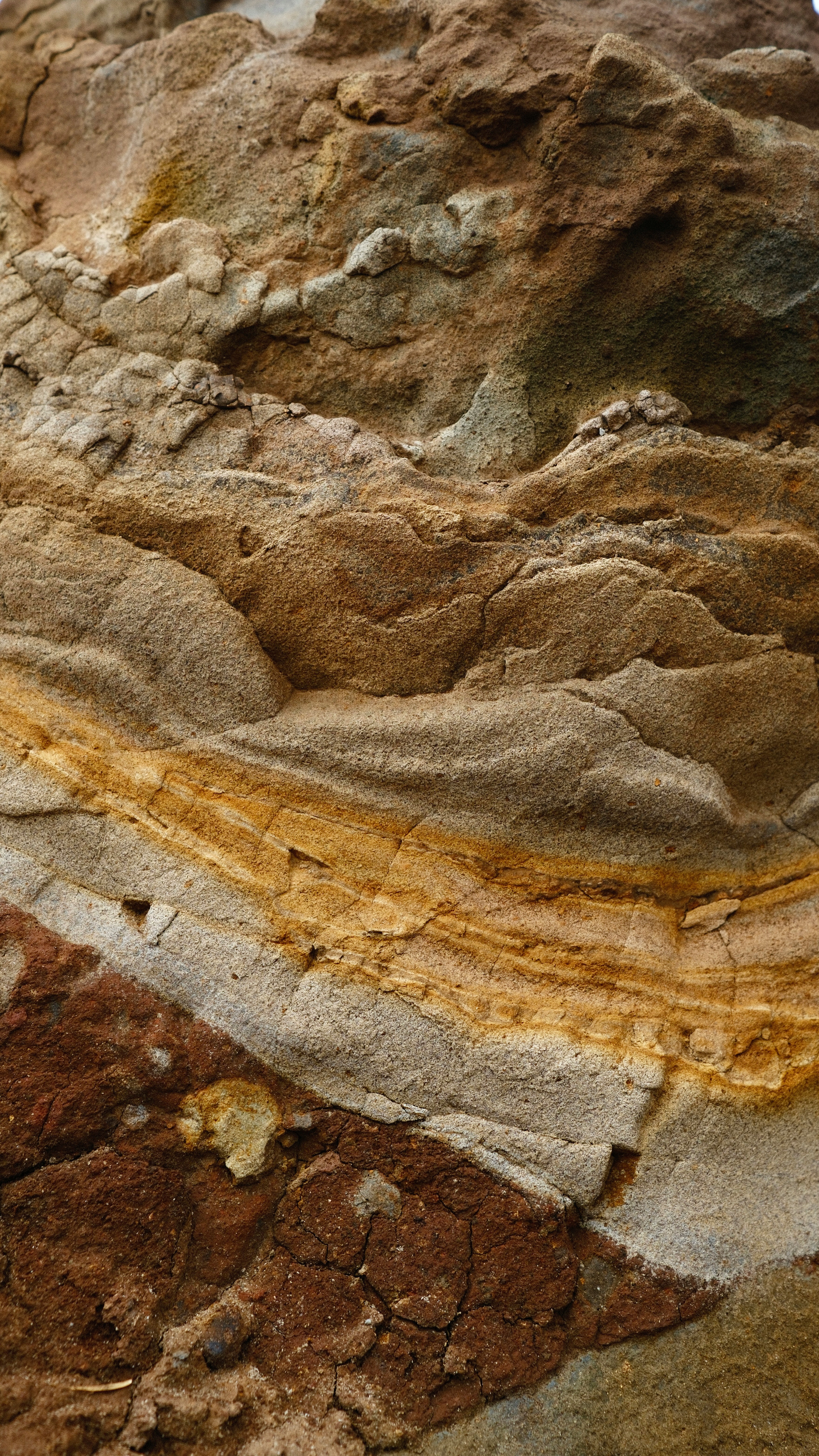 a close up of a rock with a yellow line on it